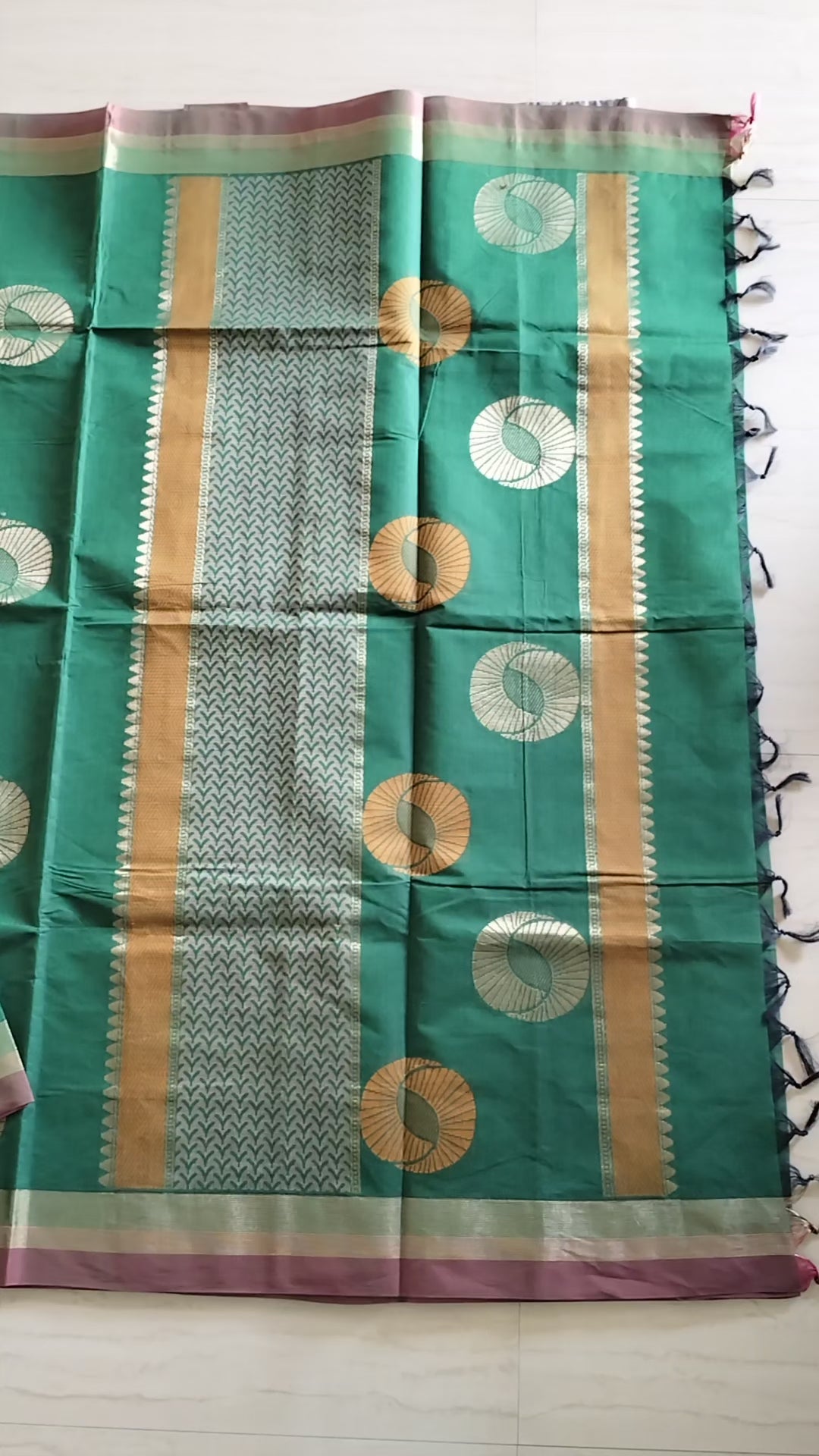 Cotton saree with golden zari & orange buttas.