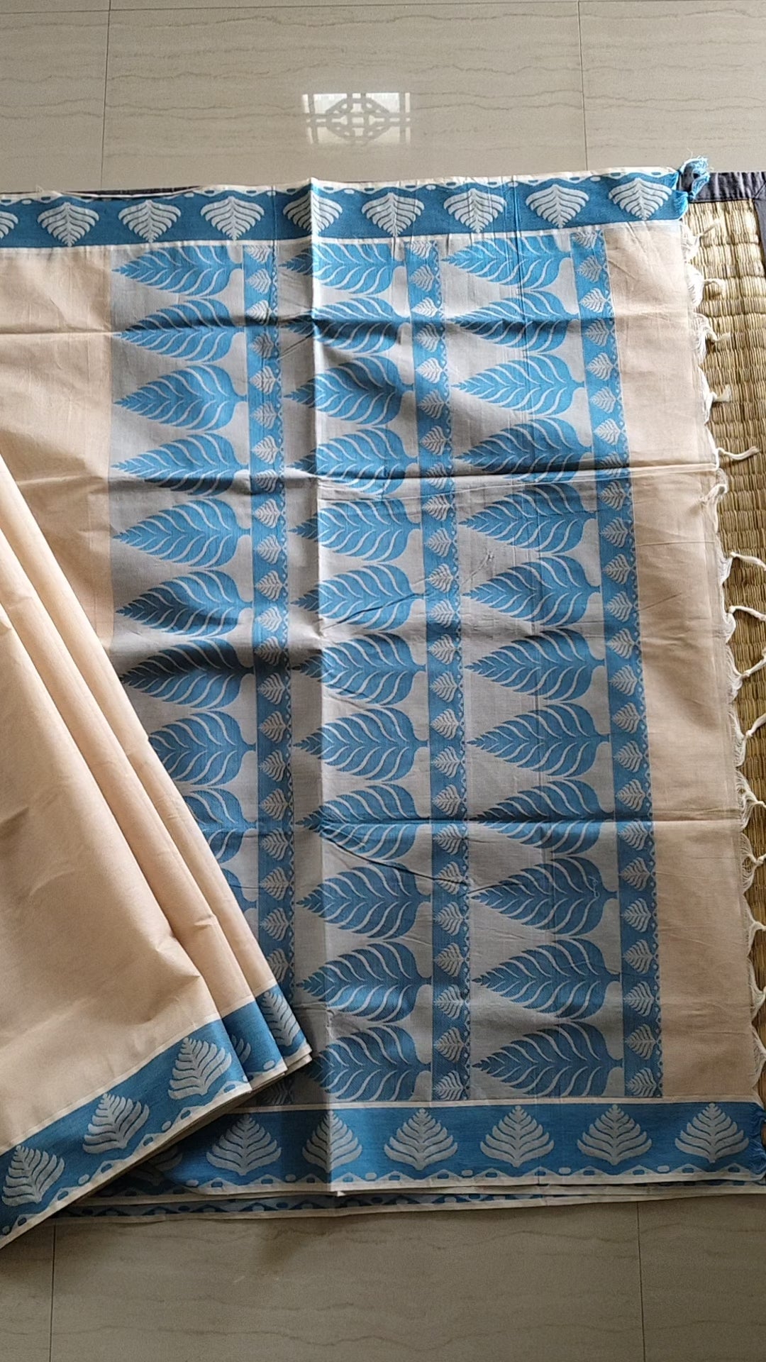 Pastel cream embossed cotton saree with blue thread work