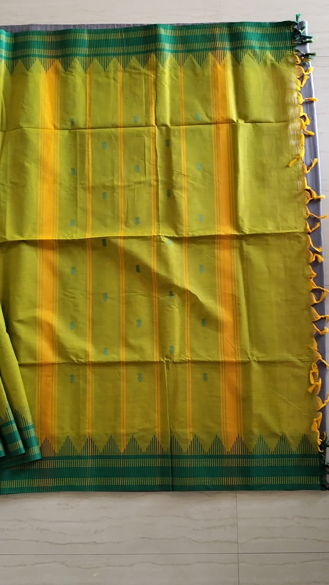 Bright yellow-green cotton saree with buttas all over