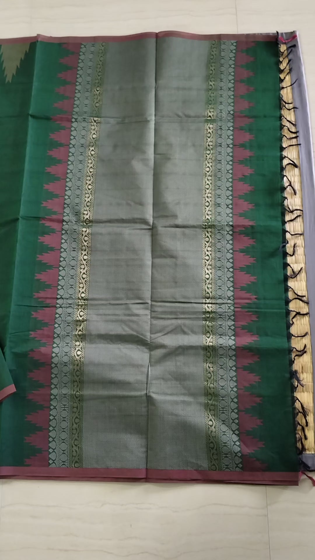 Dark green cotton saree with temple border