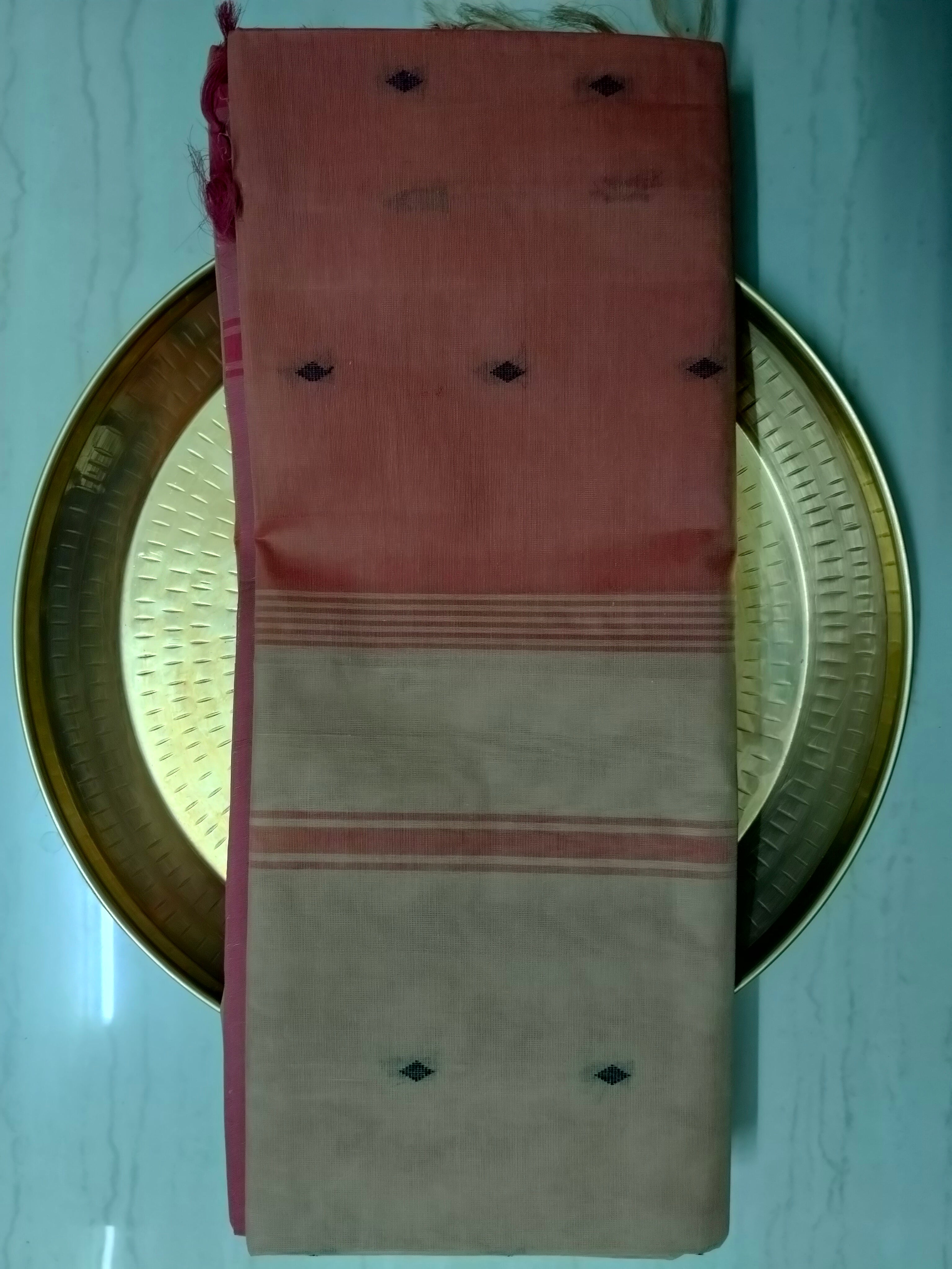 Tart orange cotton saree with beige pallu