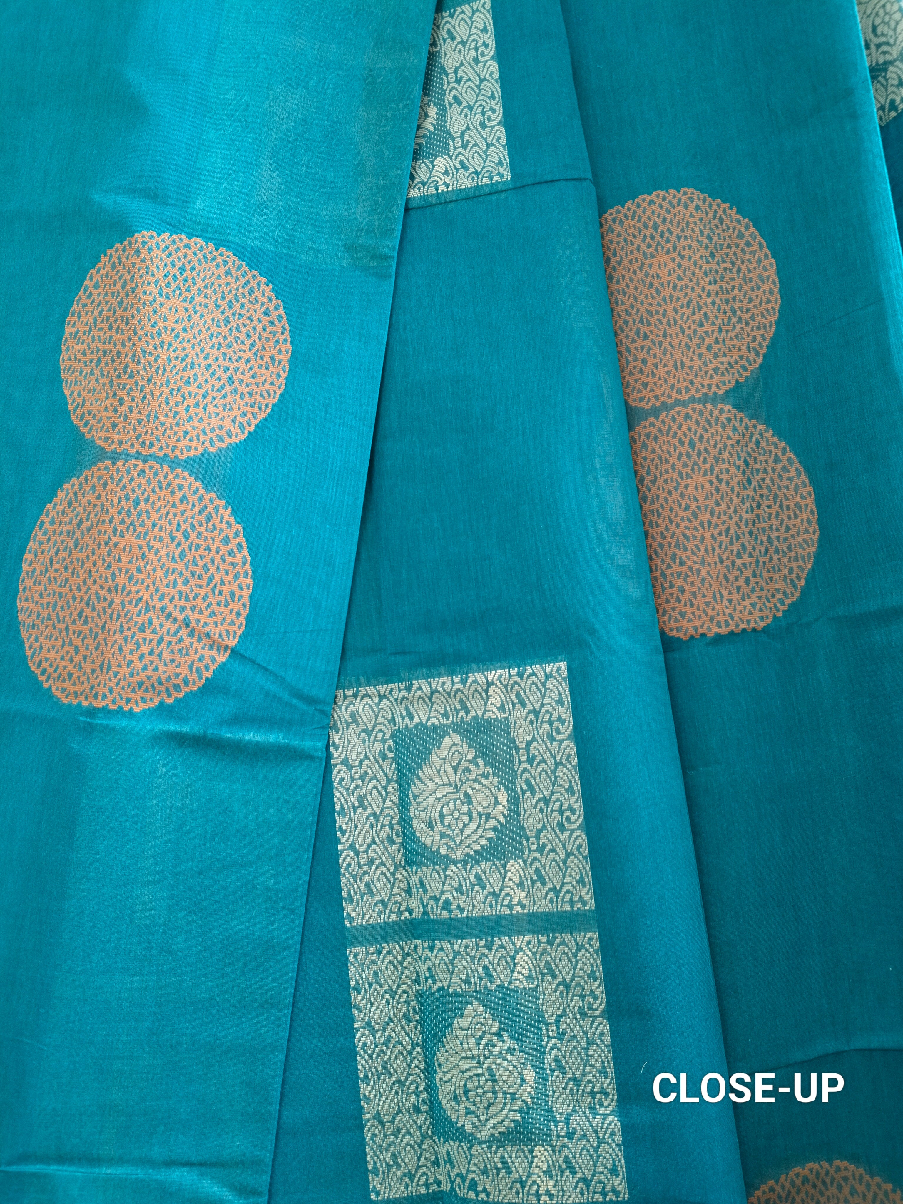 Blue cotton saree with silver & copper zari buttas