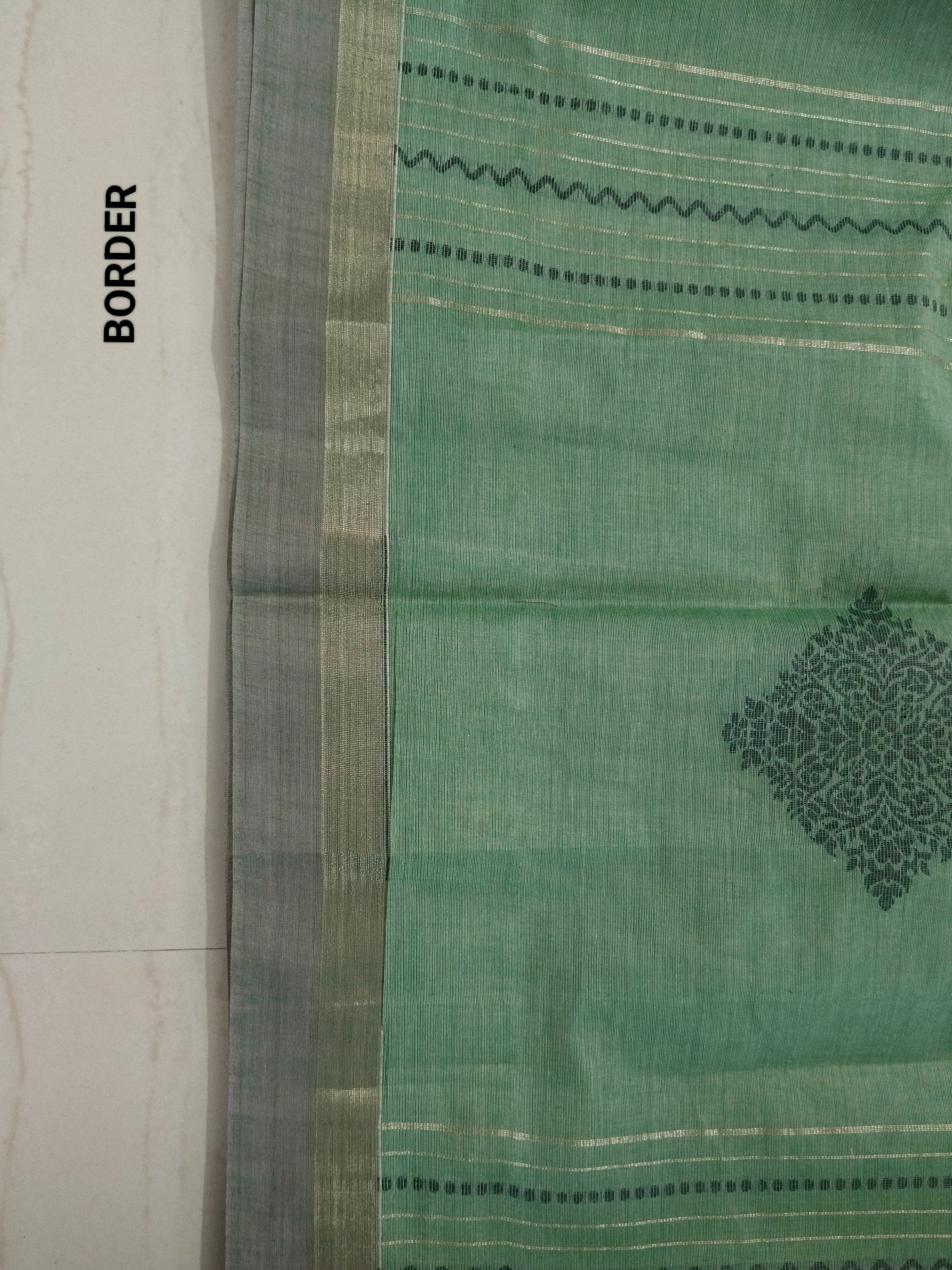 Green cotton saree with golden zari vertical lines & buttas
