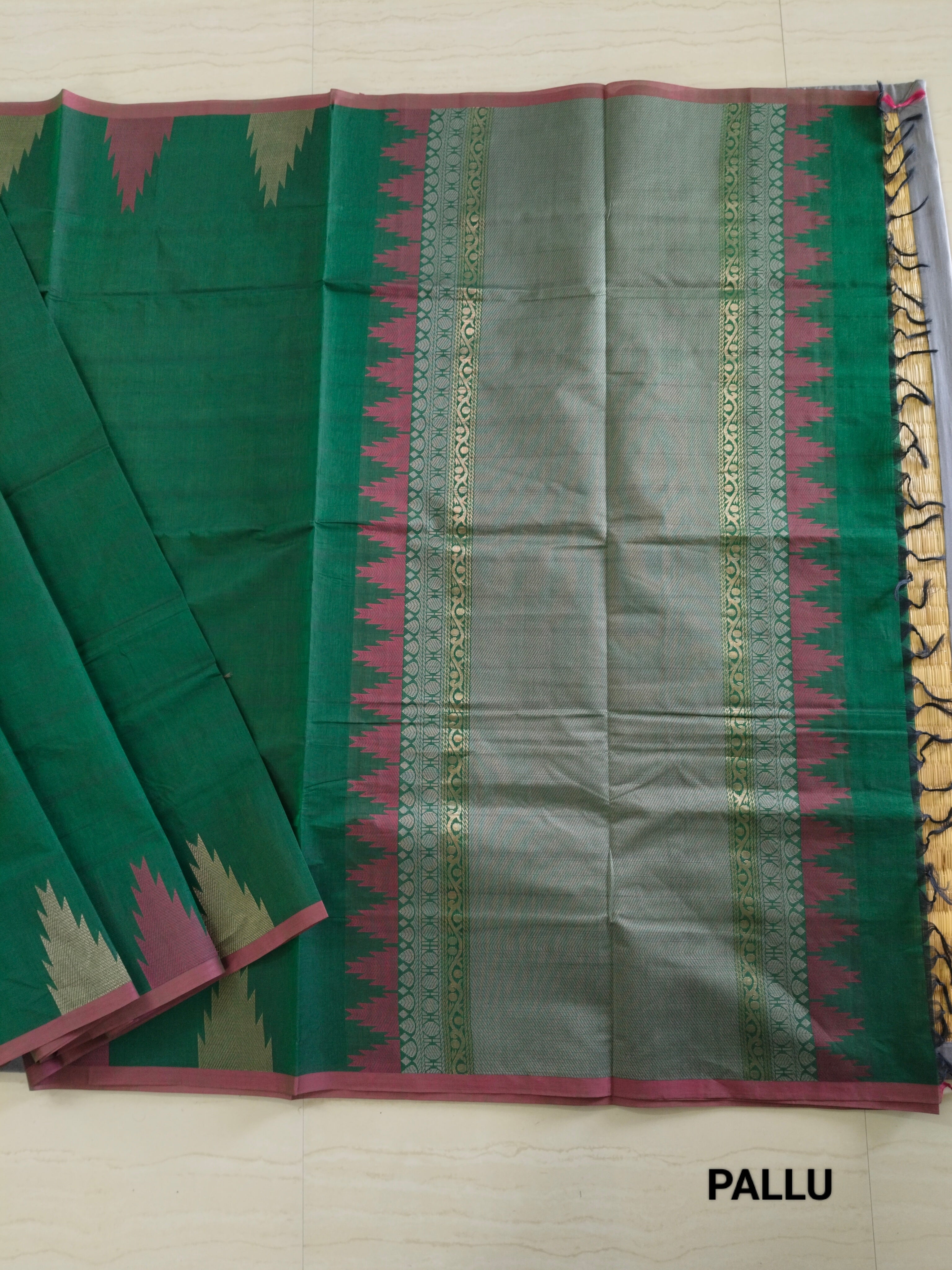 Dark green cotton saree with temple border