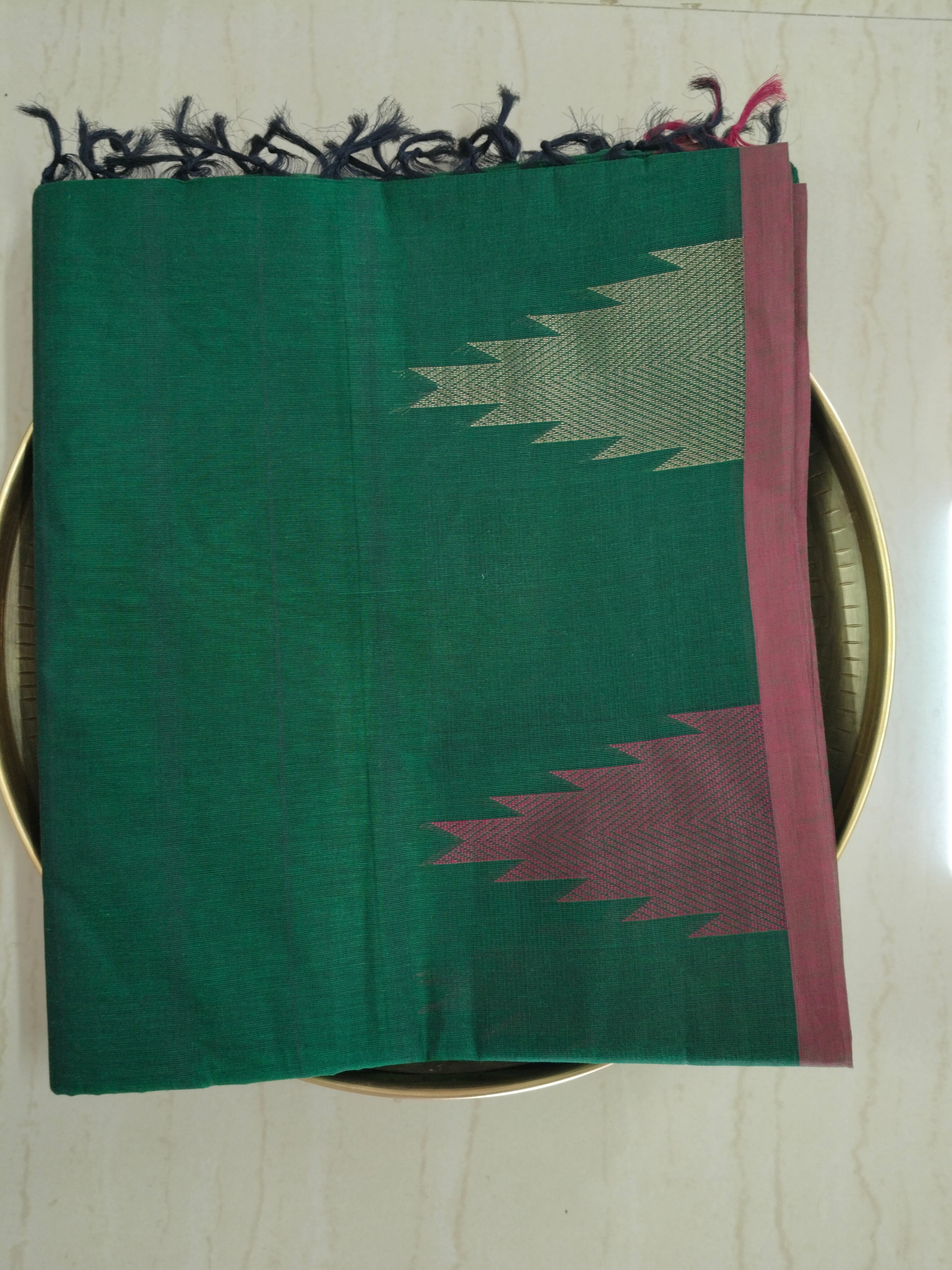 Dark green cotton saree with temple border