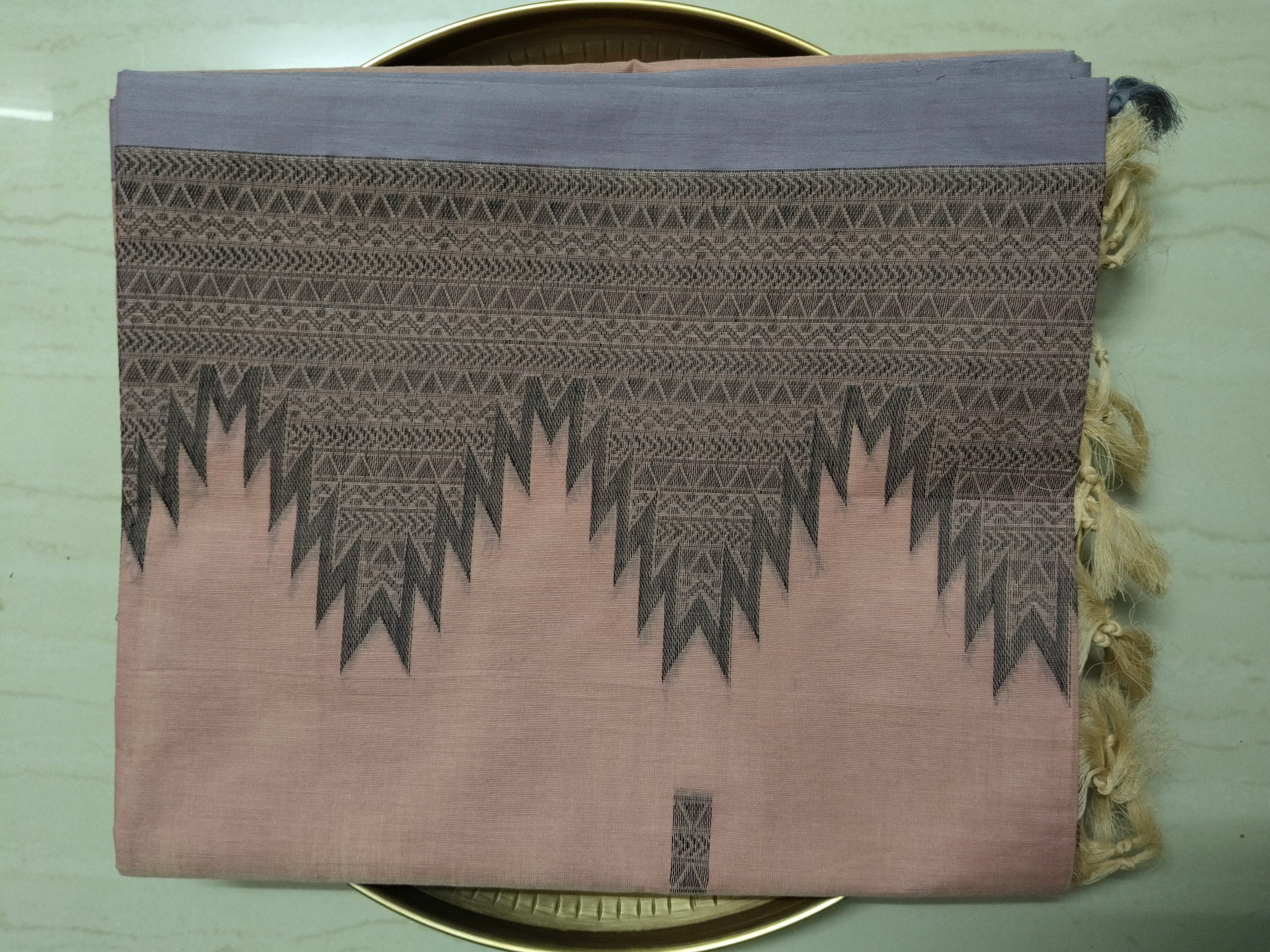 Pastel pink cotton saree with black buttas & one side temple border