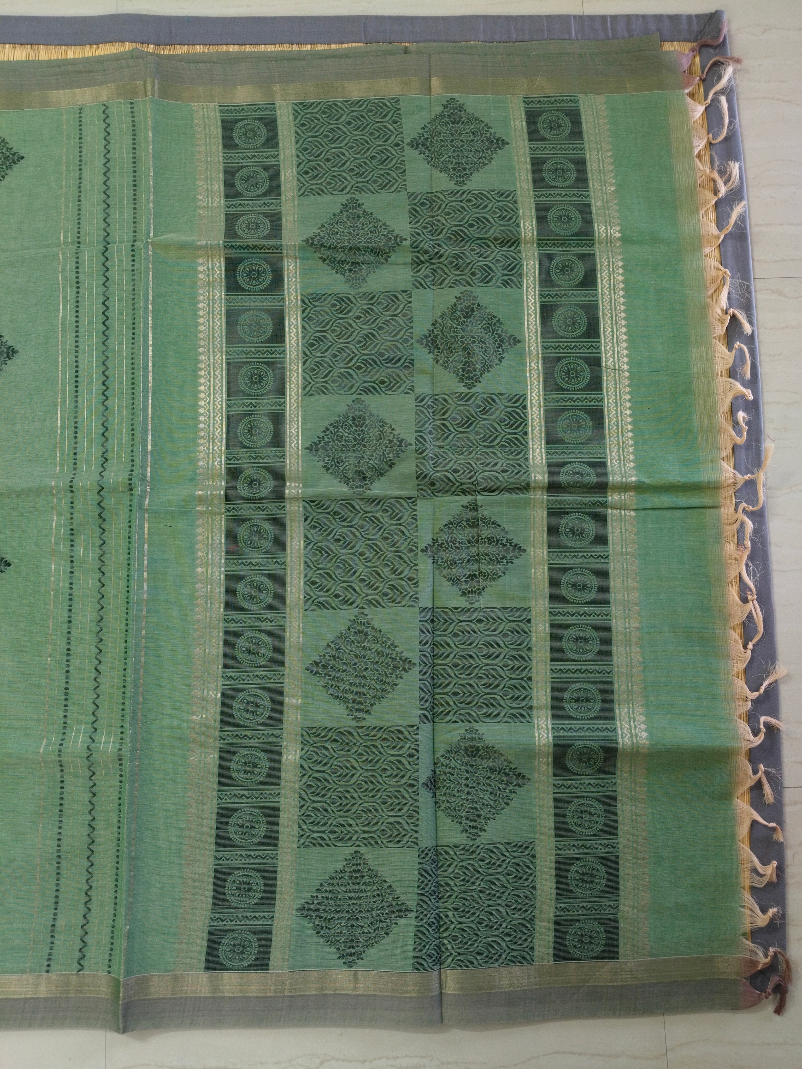 Green cotton saree with golden zari vertical lines & buttas