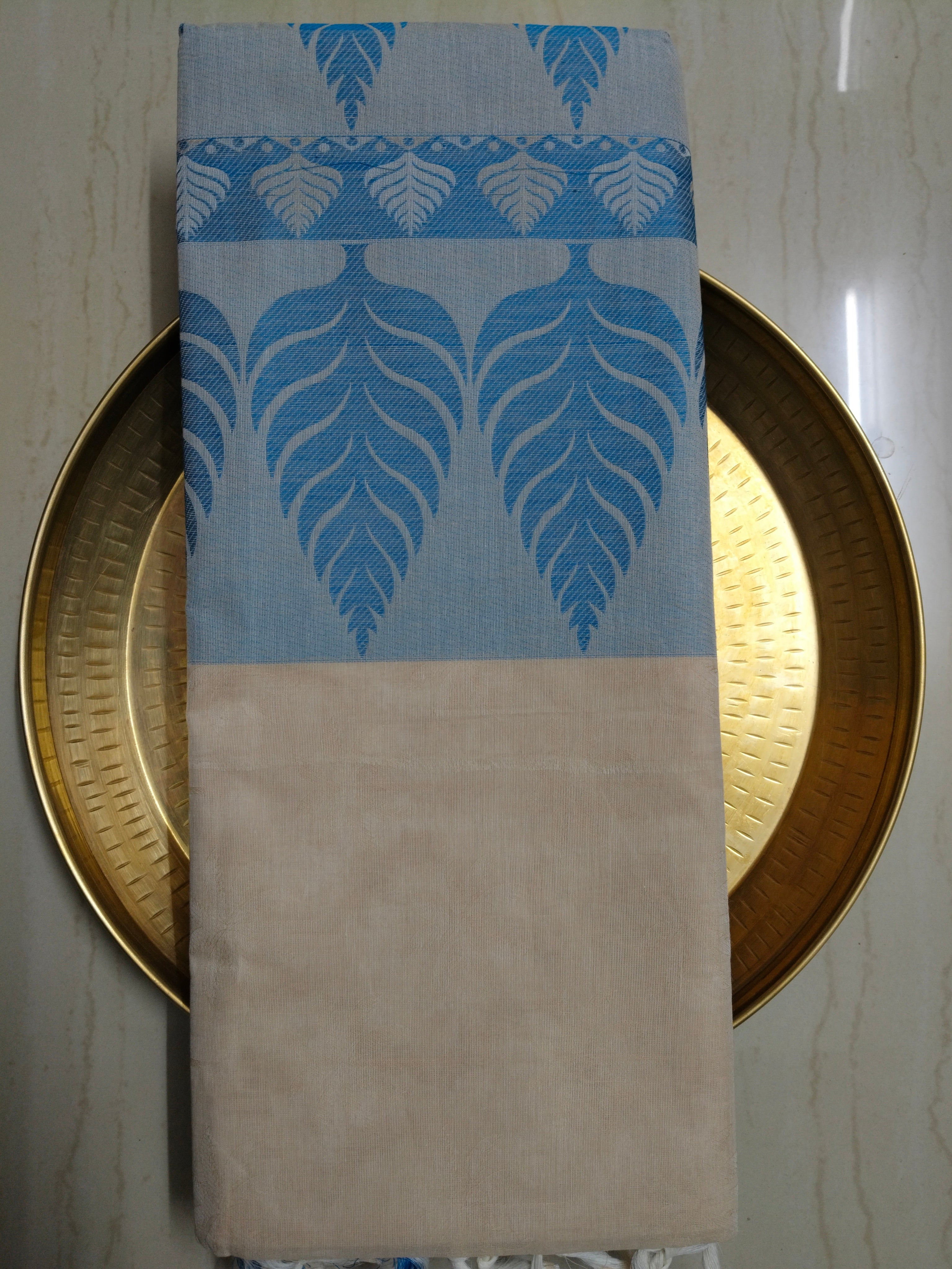 Pastel cream embossed cotton saree with blue thread work
