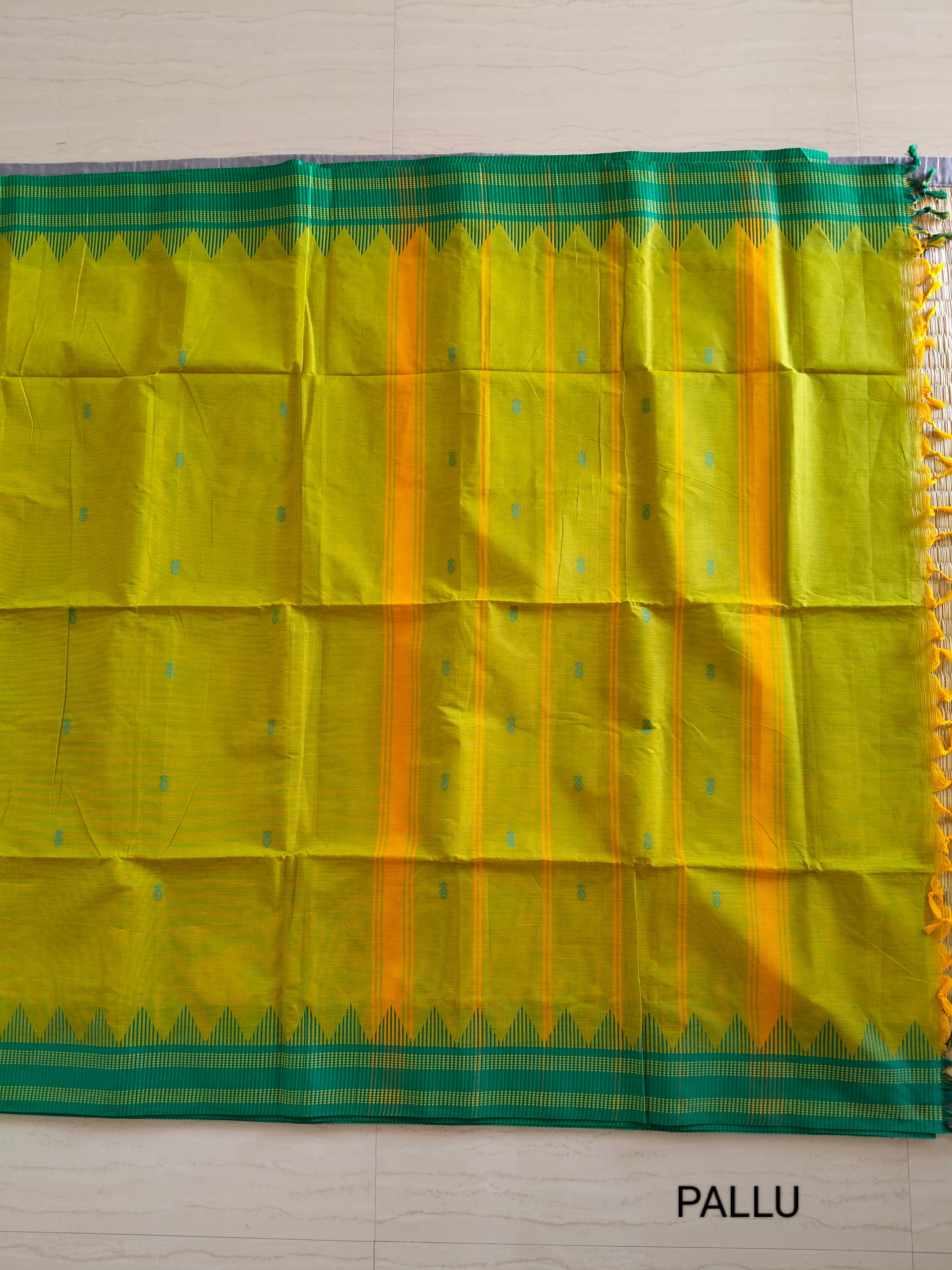 Bright yellow-green cotton saree with buttas all over