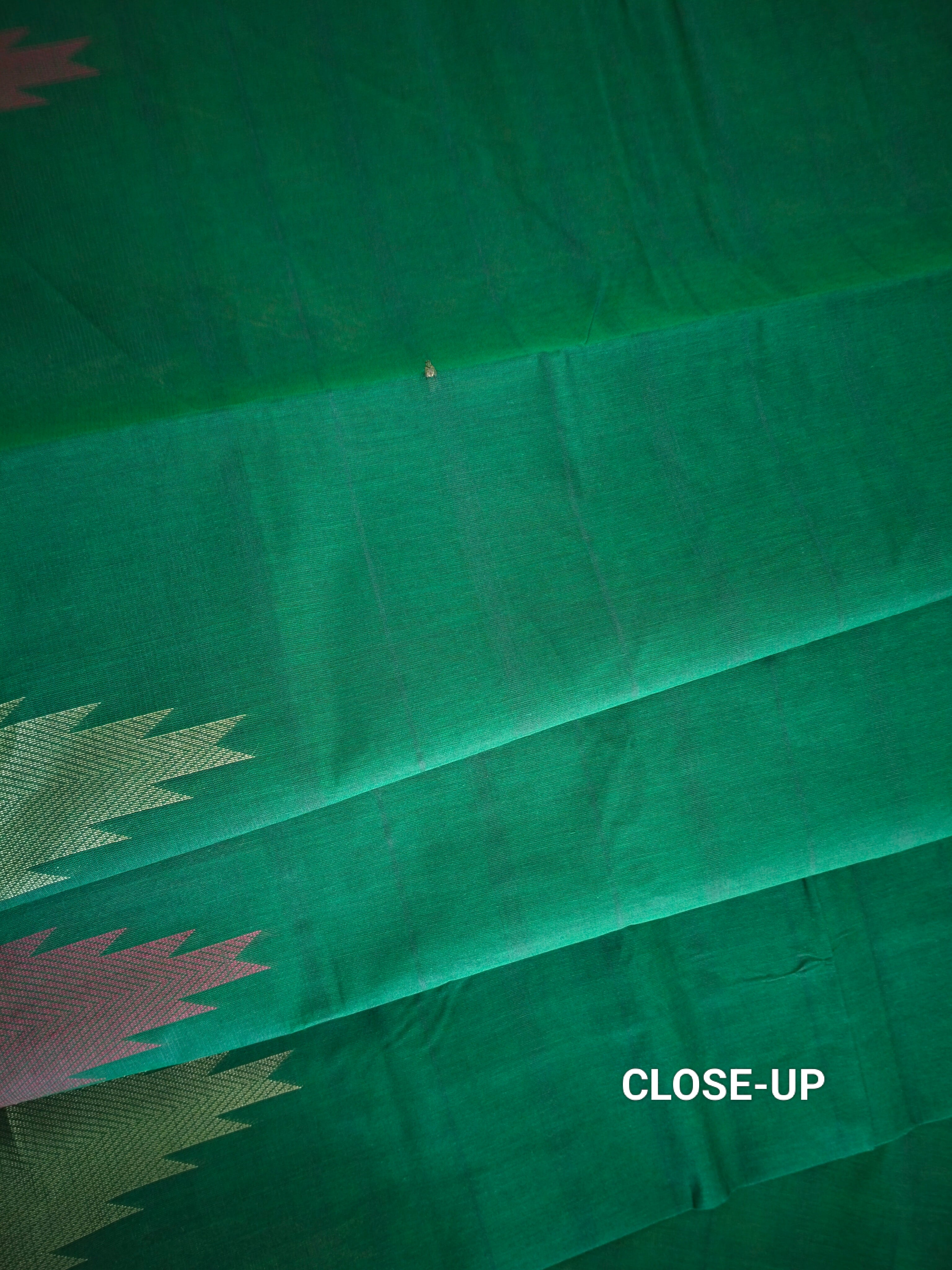 Dark green cotton saree with temple border