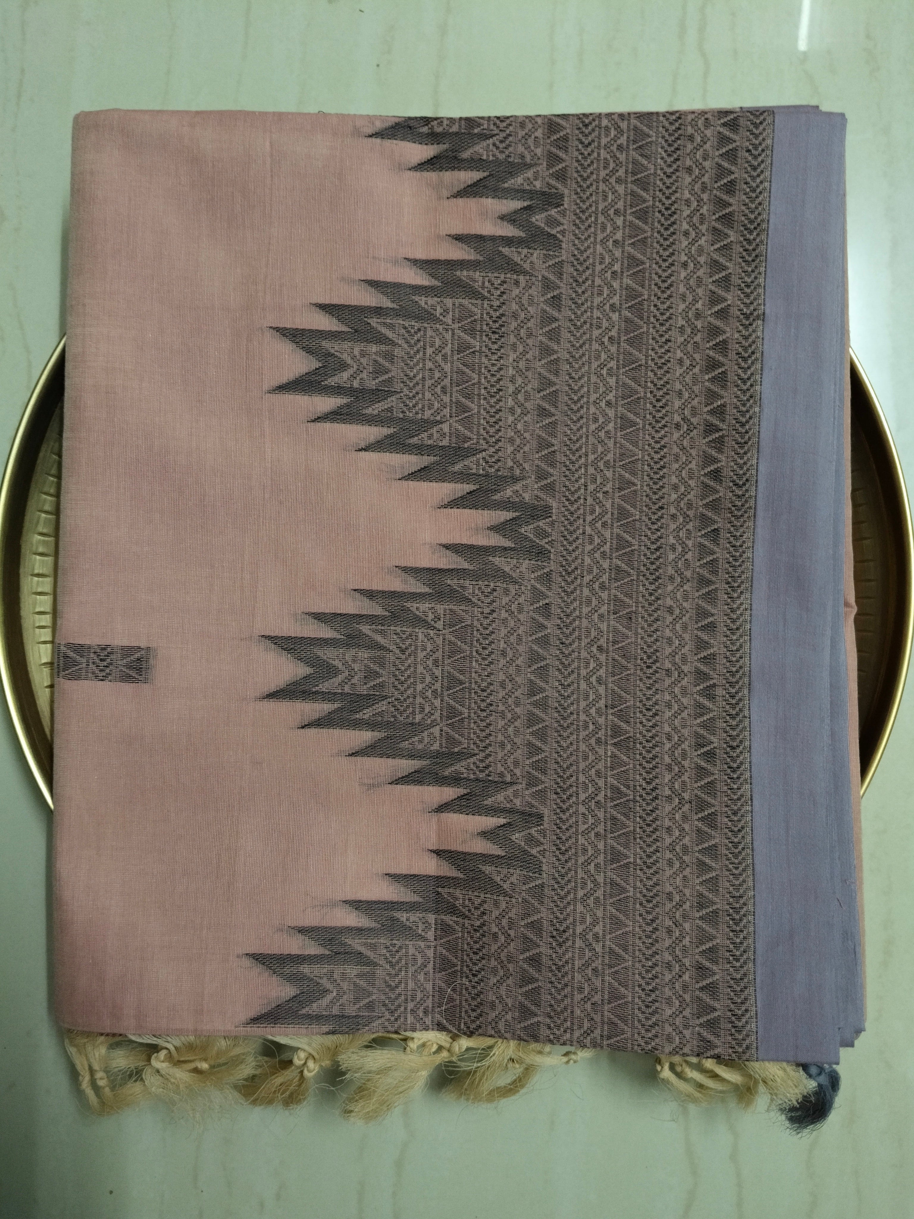Pastel pink cotton saree with black buttas & one side temple border