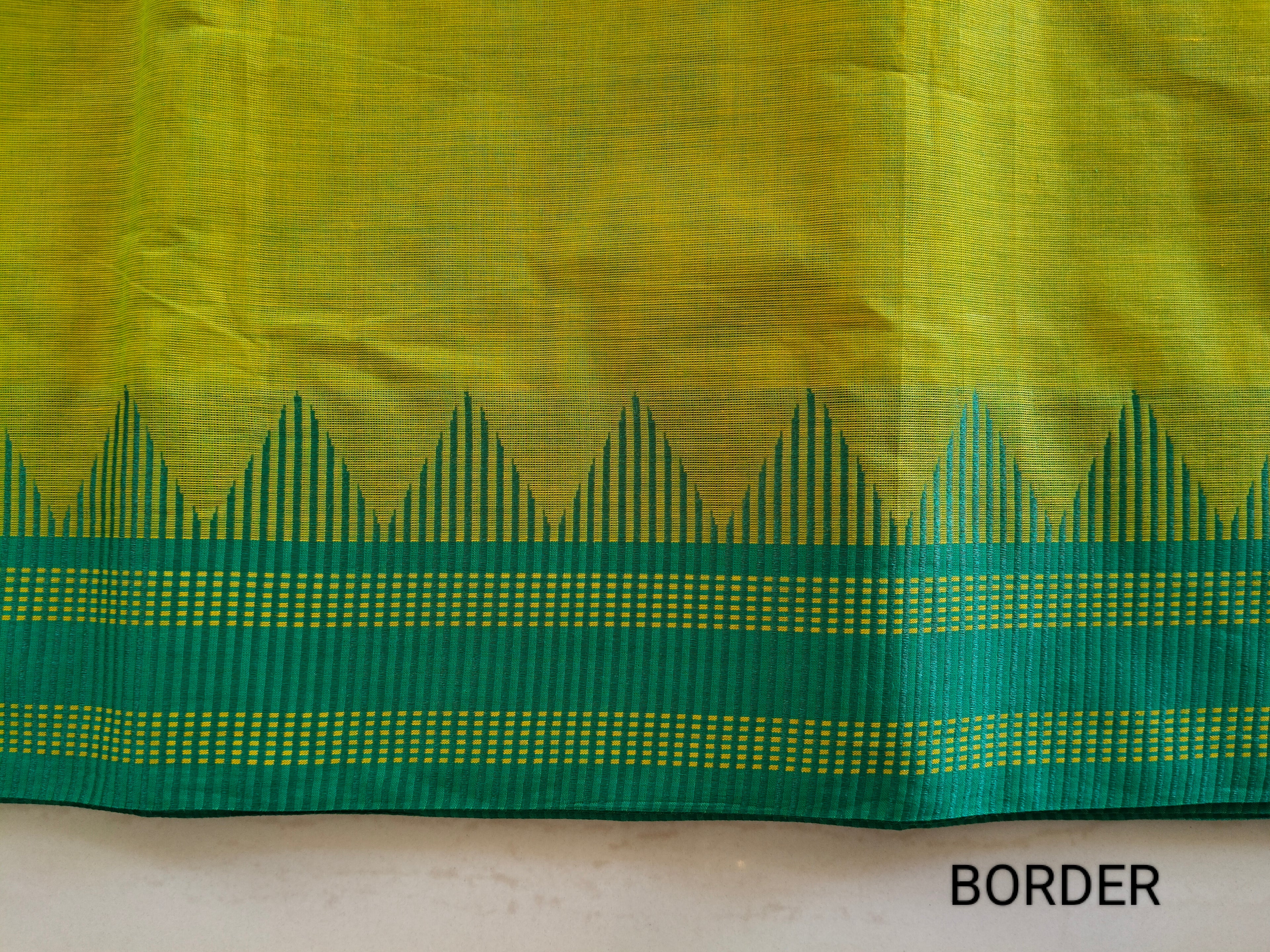 Bright yellow-green cotton saree with buttas all over