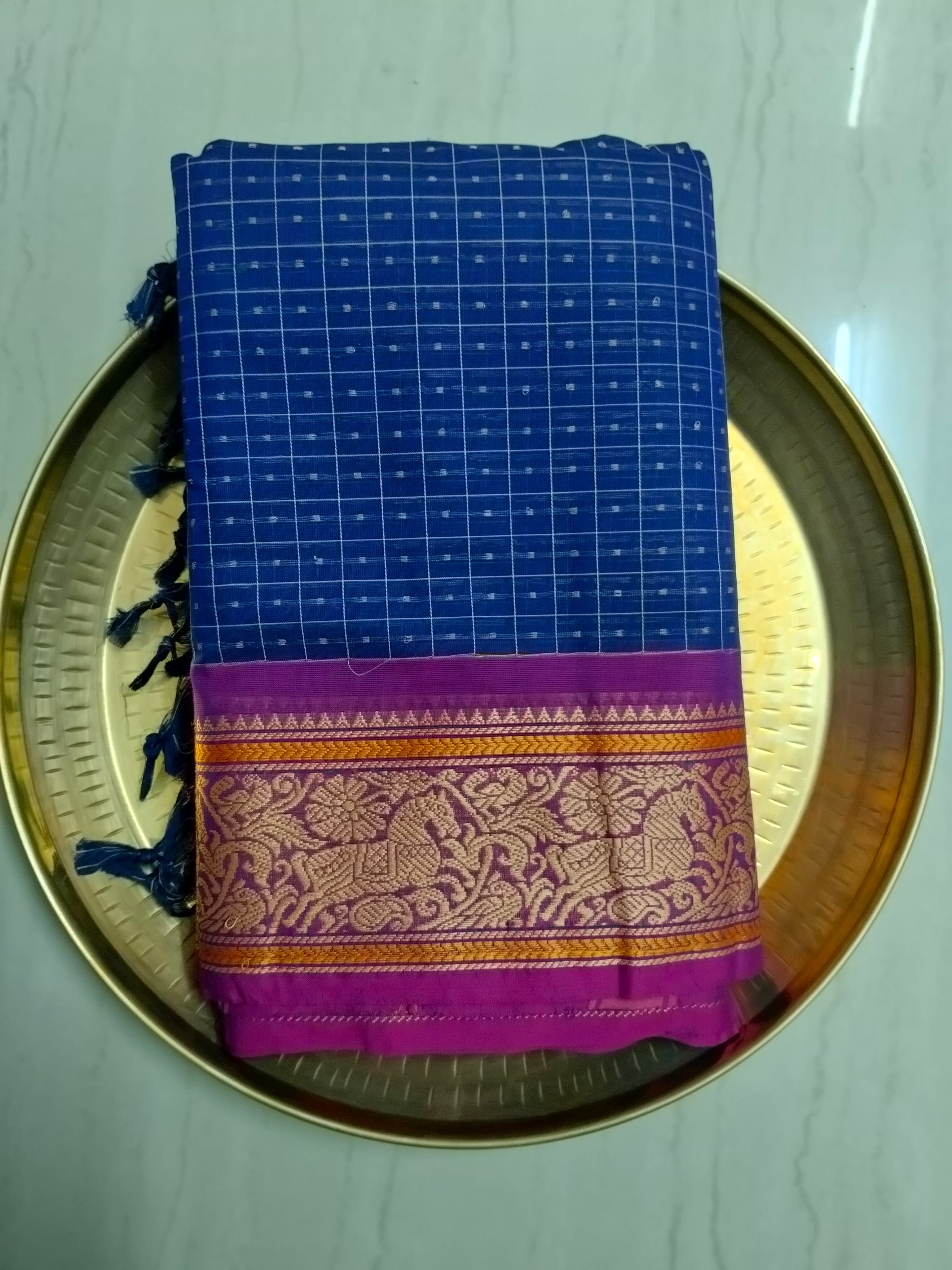 Blue Lakshadeepam saree with pink embroidered border