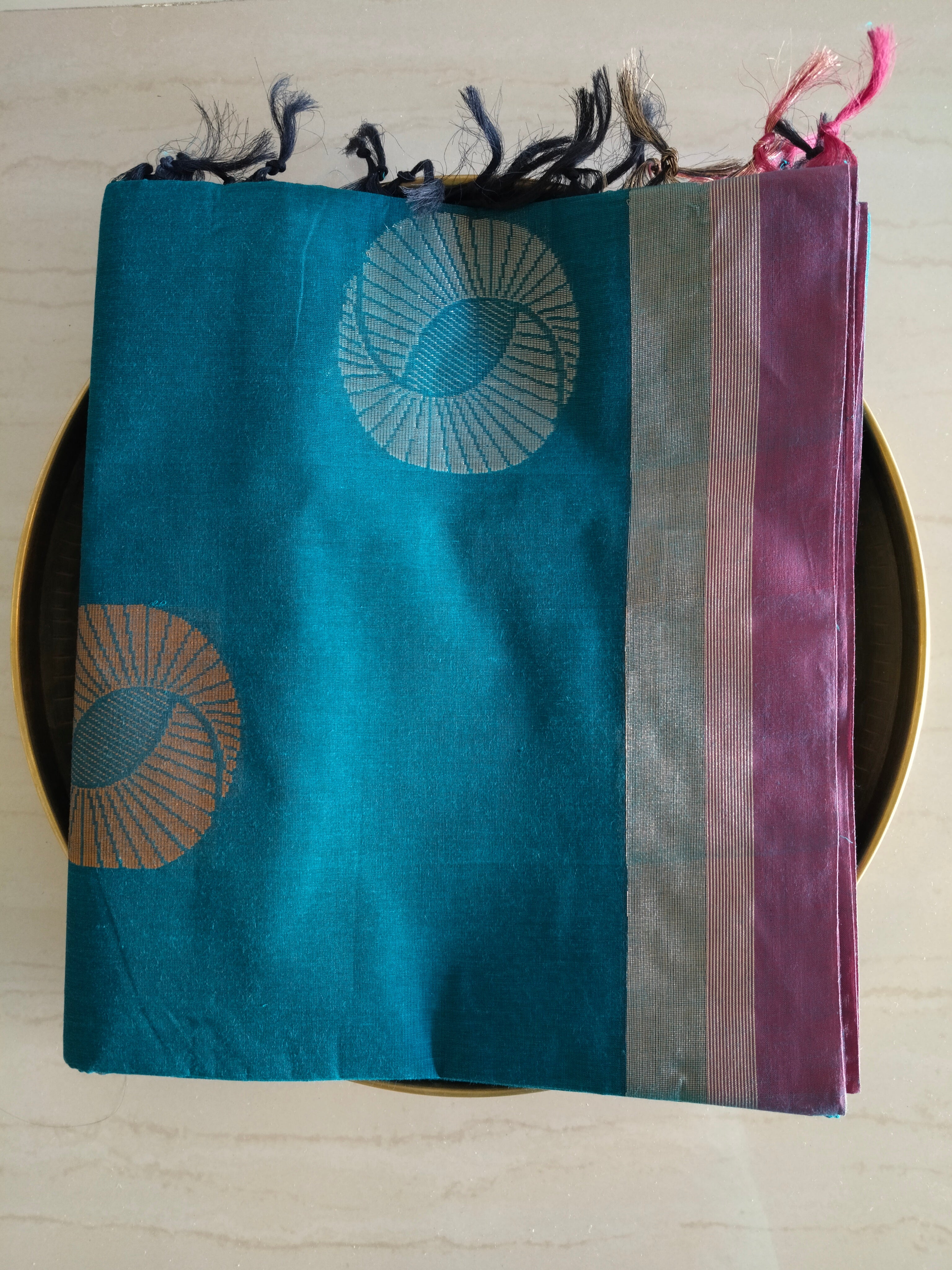 Cotton saree with golden zari & orange buttas.