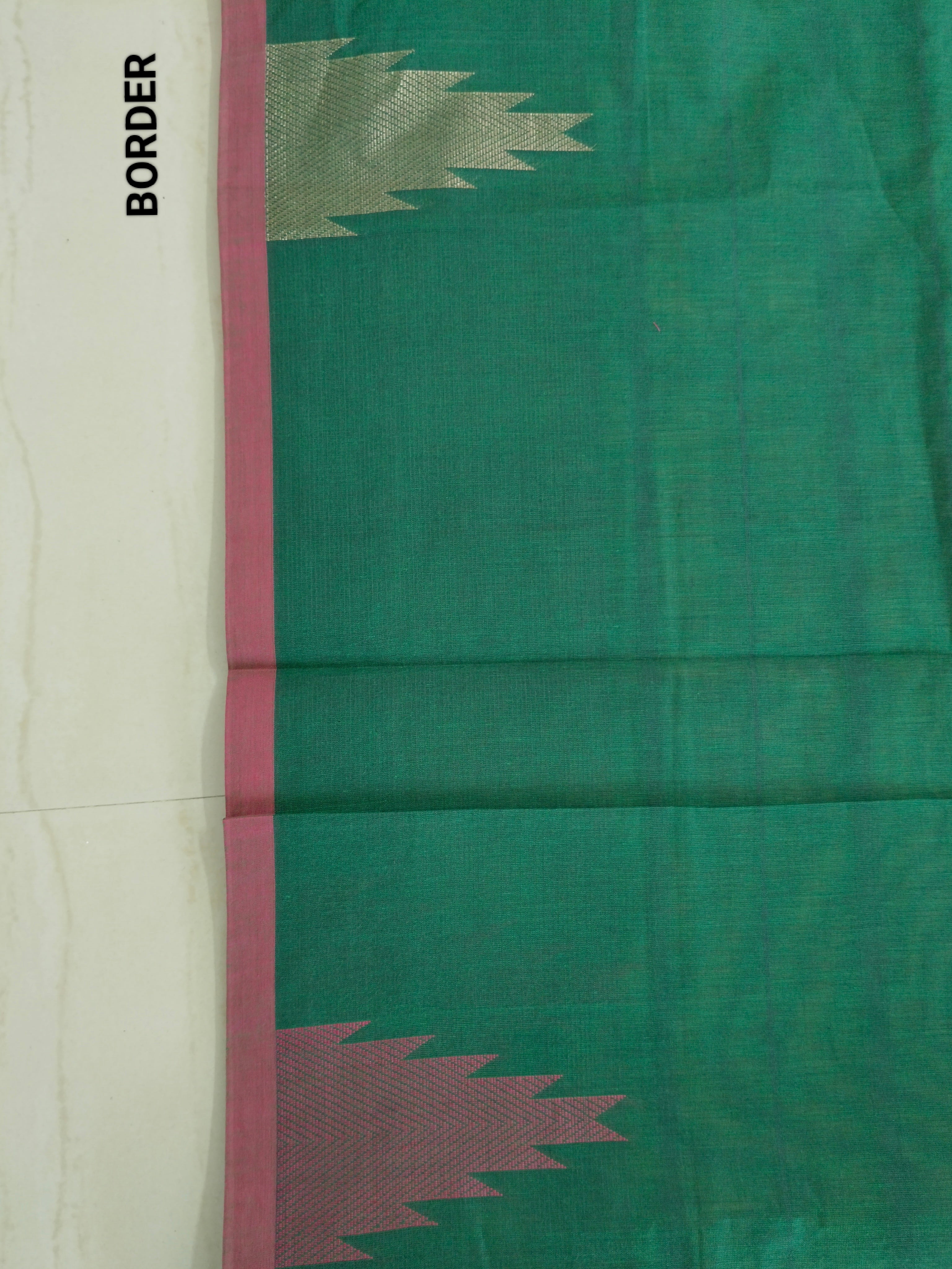 Dark green cotton saree with temple border