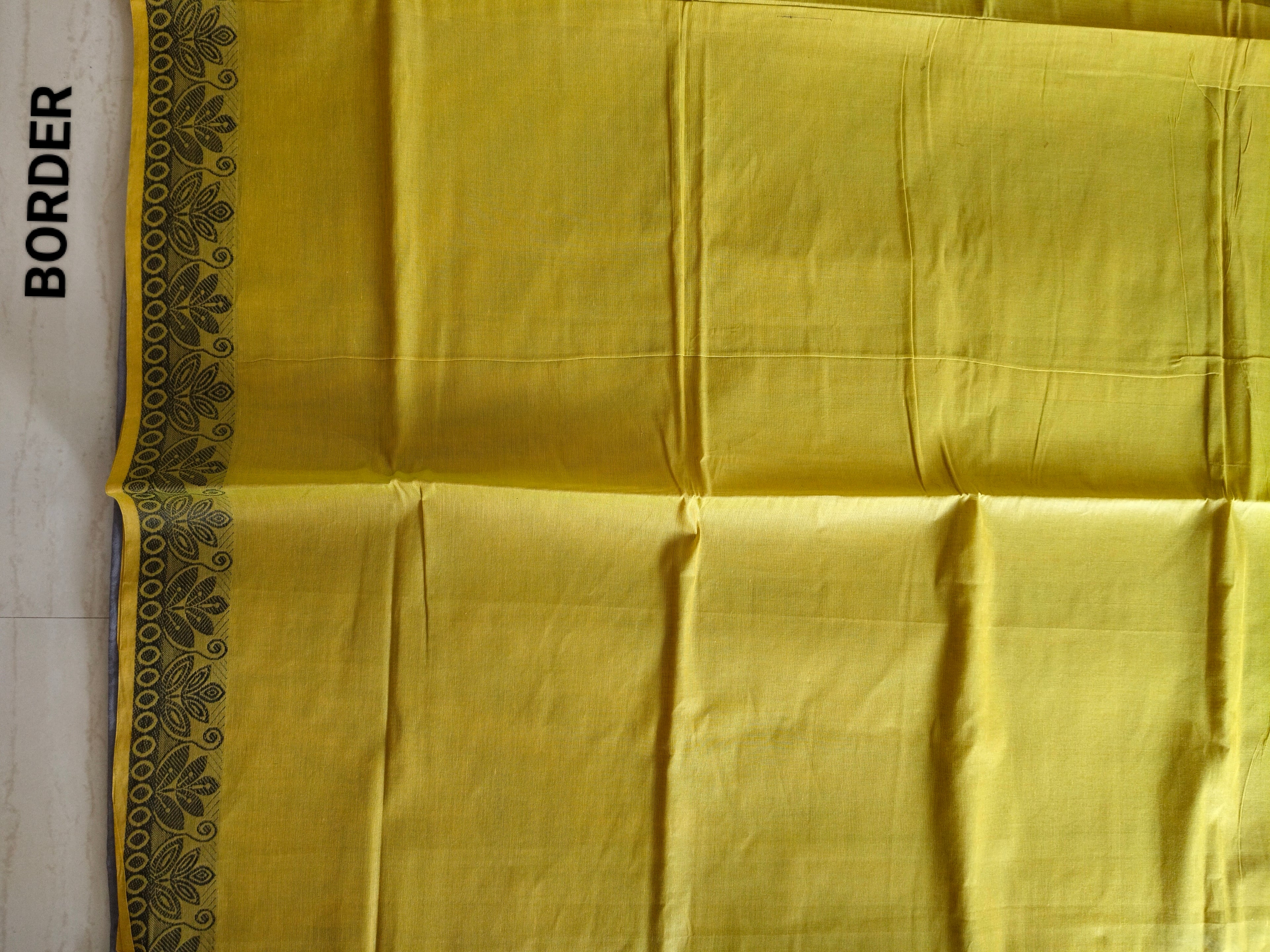 Mehandi green cotton saree with kolam buttas