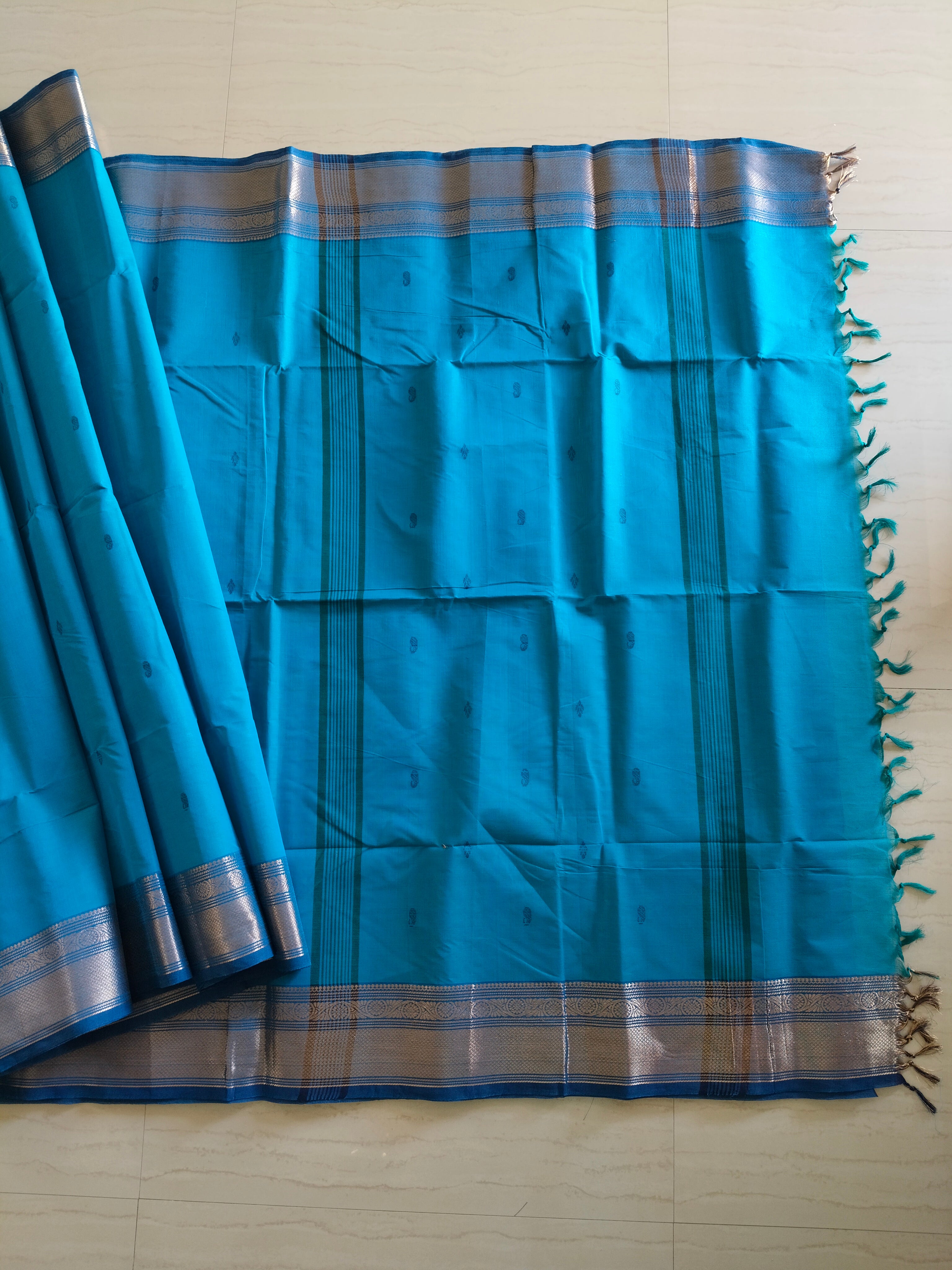 Blue chettinad cotton saree with Mango buttas and zari border