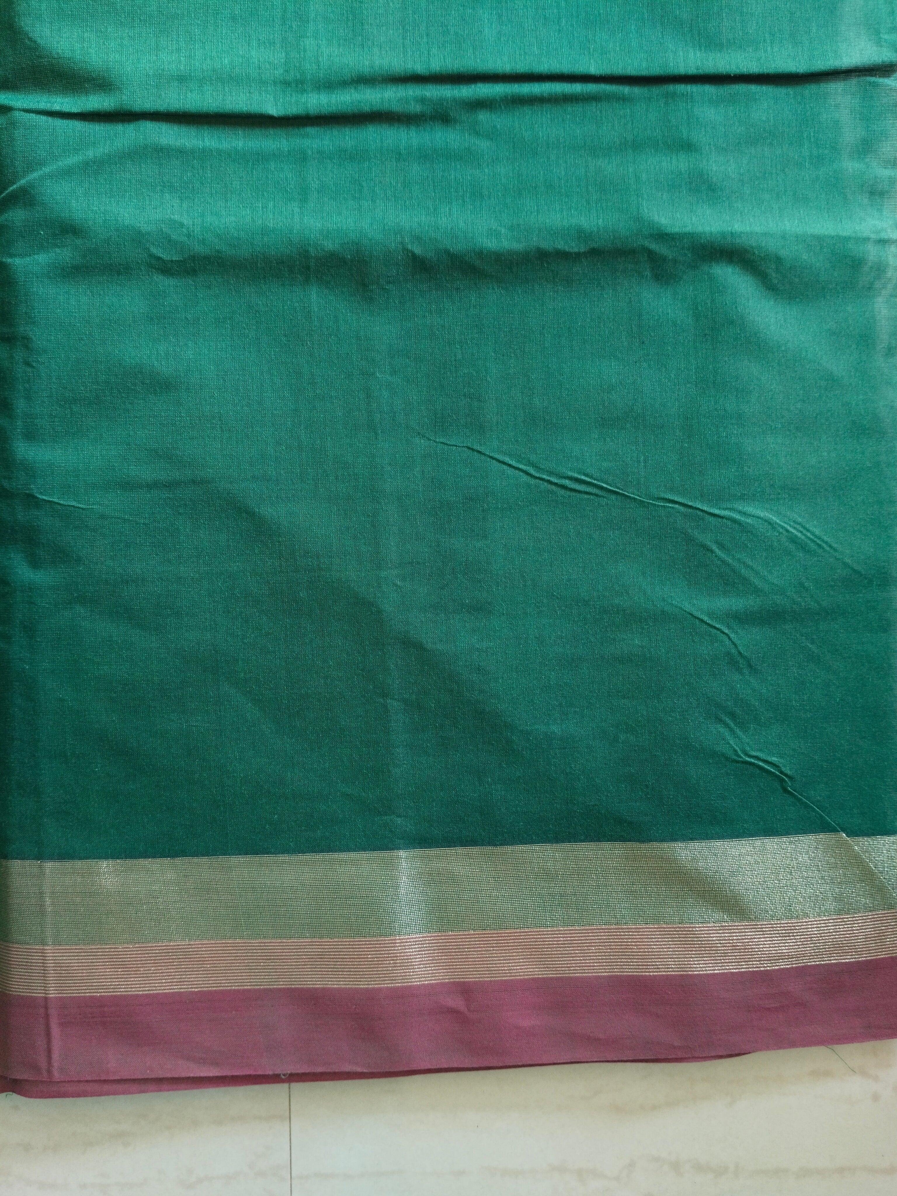 Cotton saree with golden zari & orange buttas.