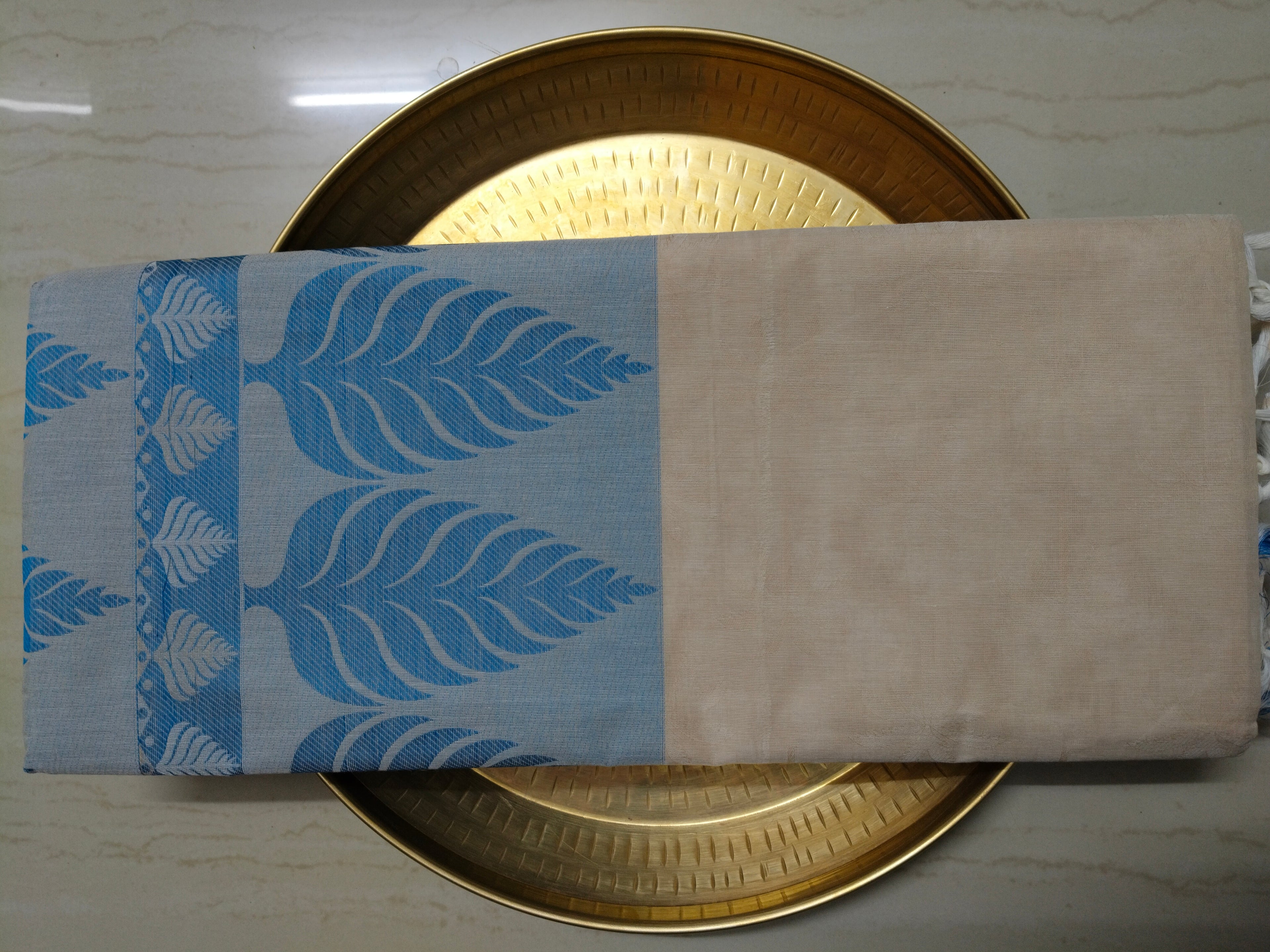 Pastel cream embossed cotton saree with blue thread work