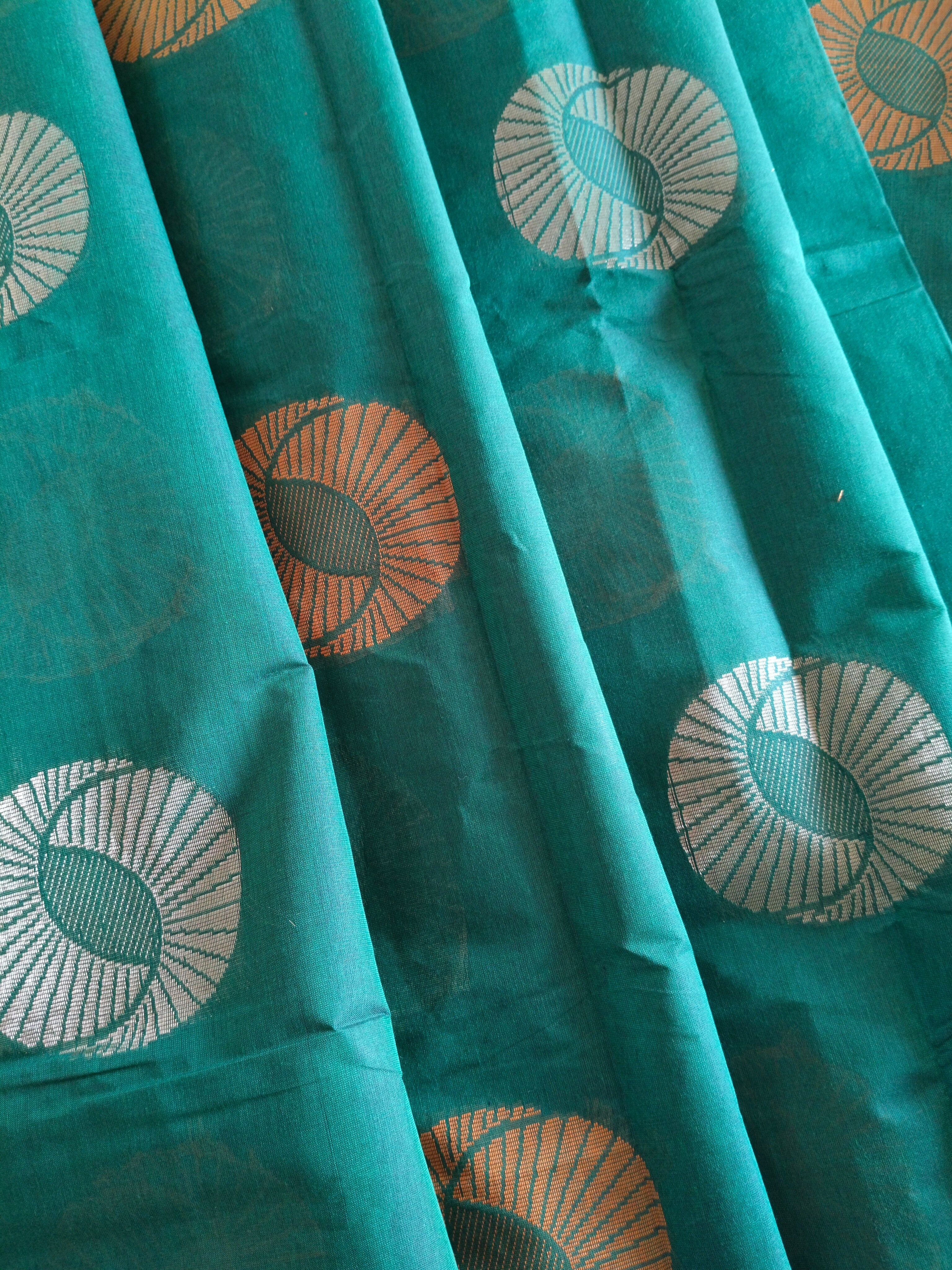 Cotton saree with golden zari & orange buttas.
