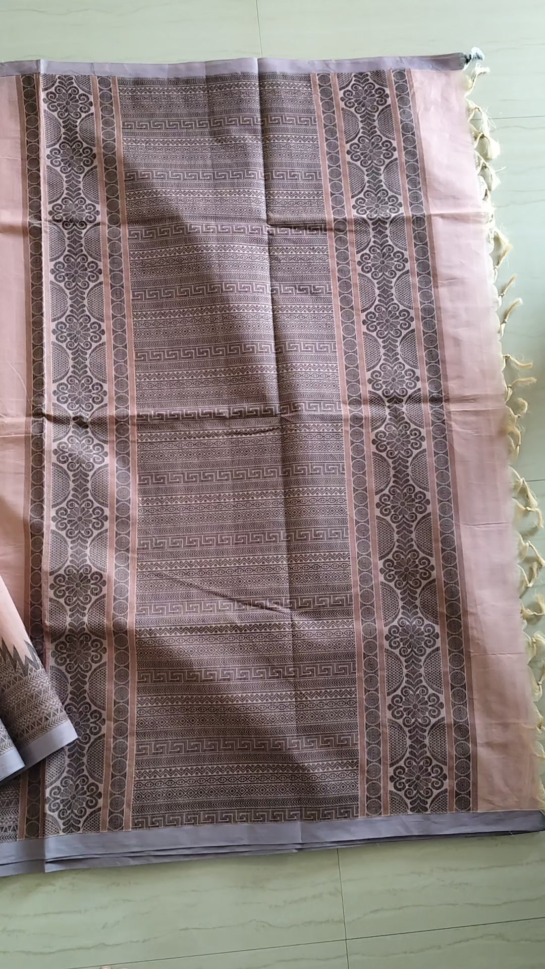 Pastel pink cotton saree with black buttas & one side temple border