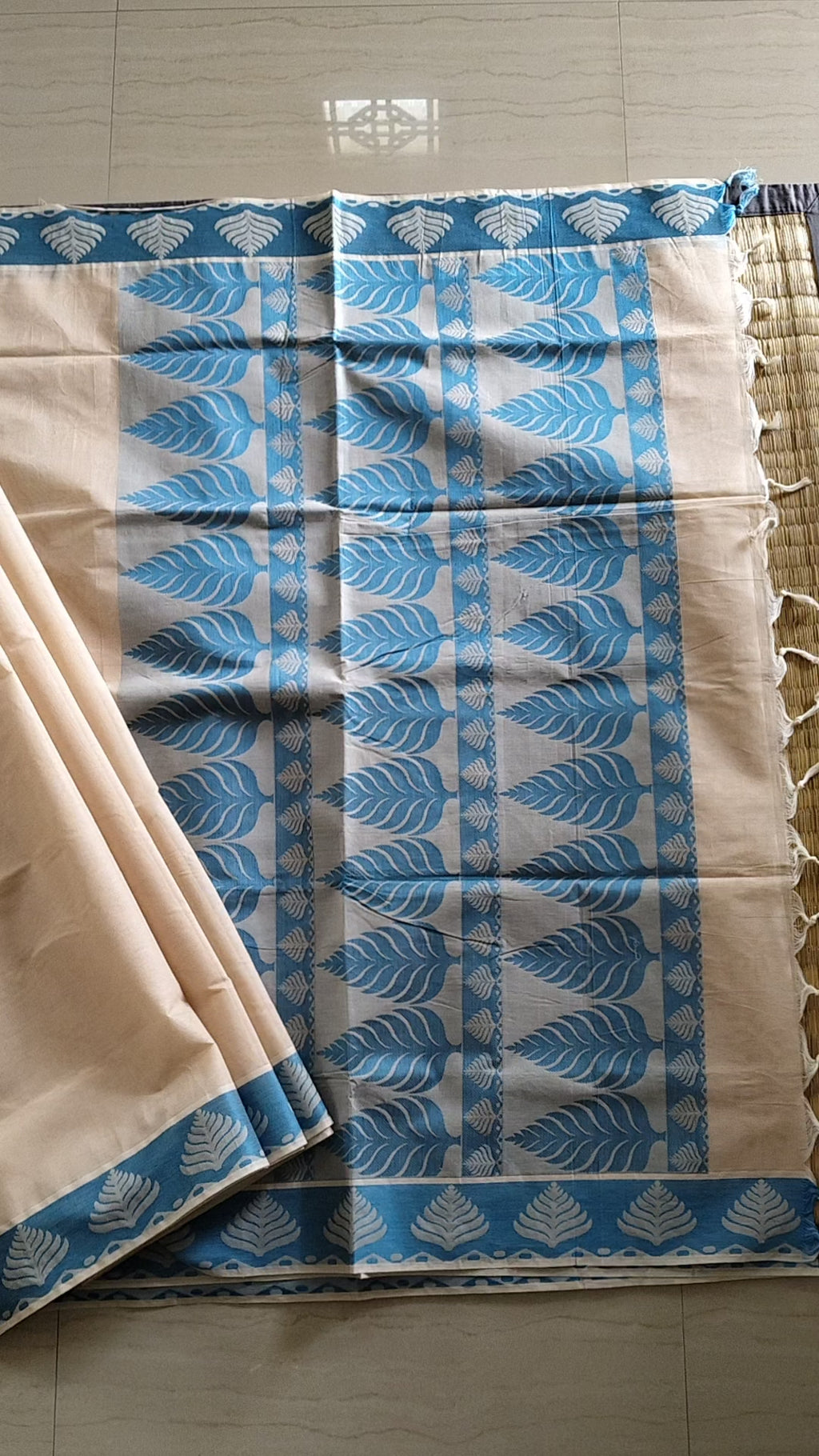 Pastel cream embossed cotton saree with blue thread work