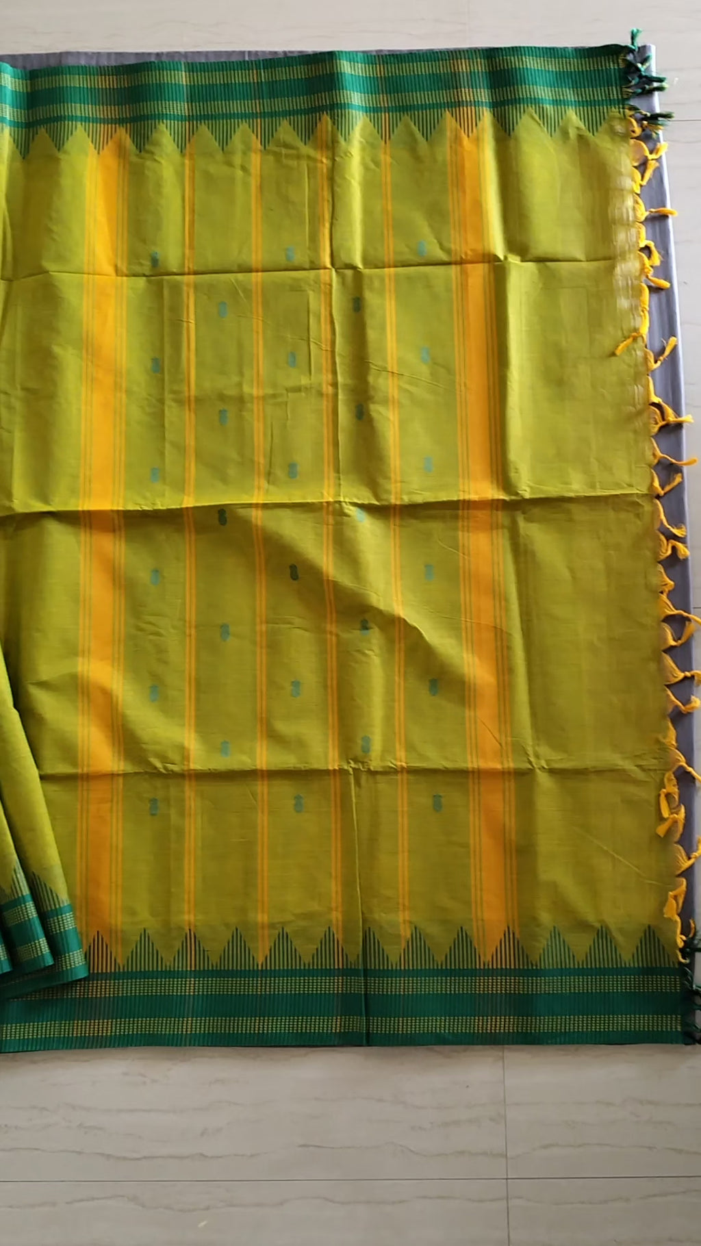 Bright yellow-green cotton saree with buttas all over