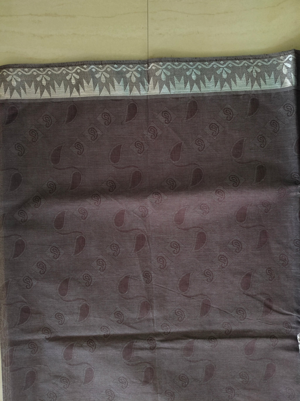 Chocolate brown embossed cotton saree with silver border and silver pallu