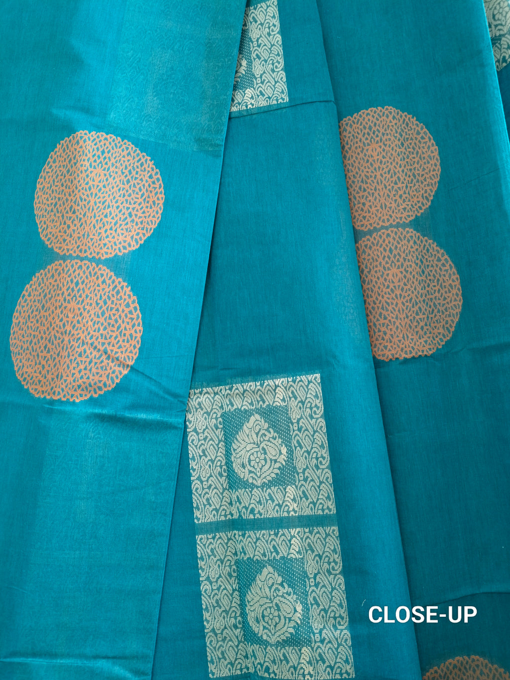 Blue cotton saree with silver & copper zari buttas