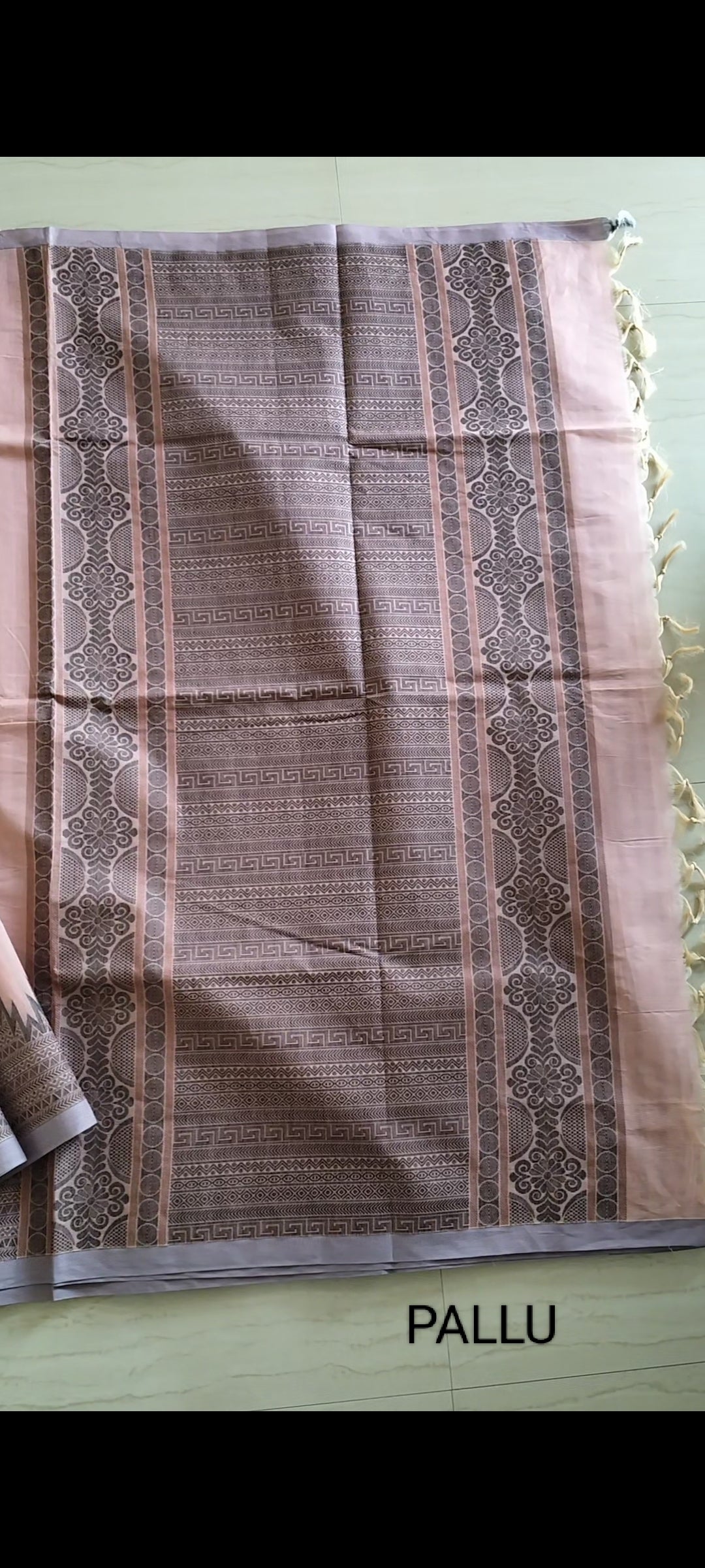 Pastel pink cotton saree with black buttas & one side temple border