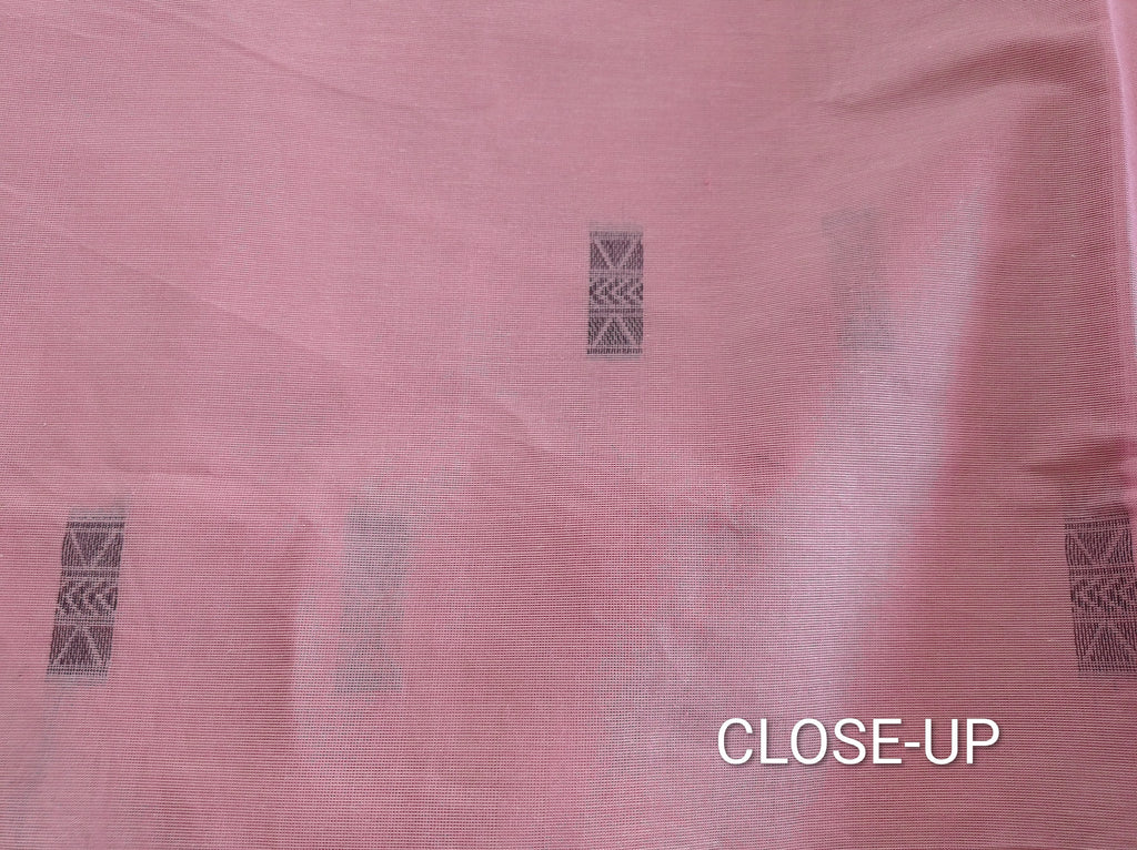 Pastel pink cotton saree with black buttas & one side temple border