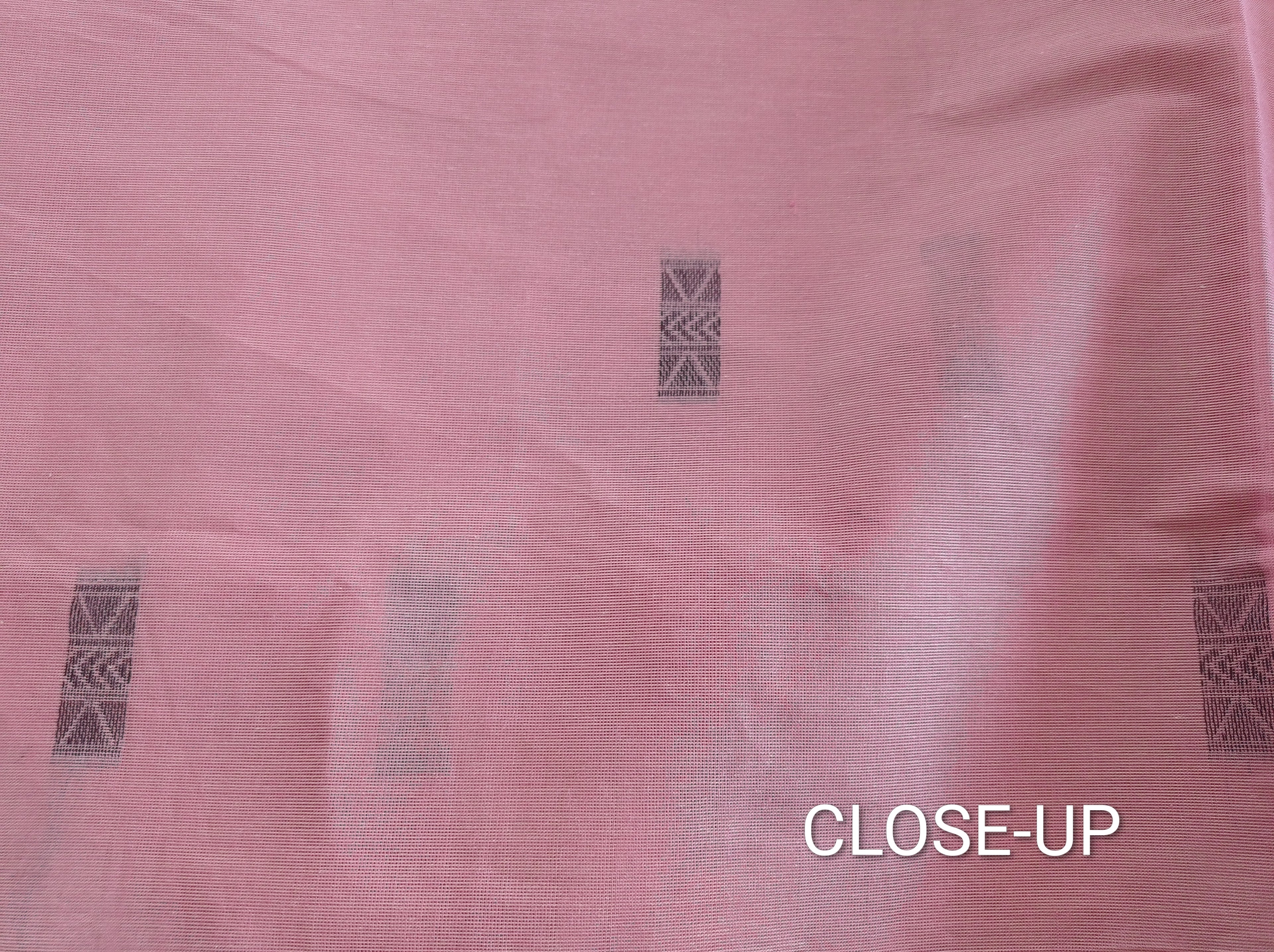 Pastel pink cotton saree with black buttas & one side temple border