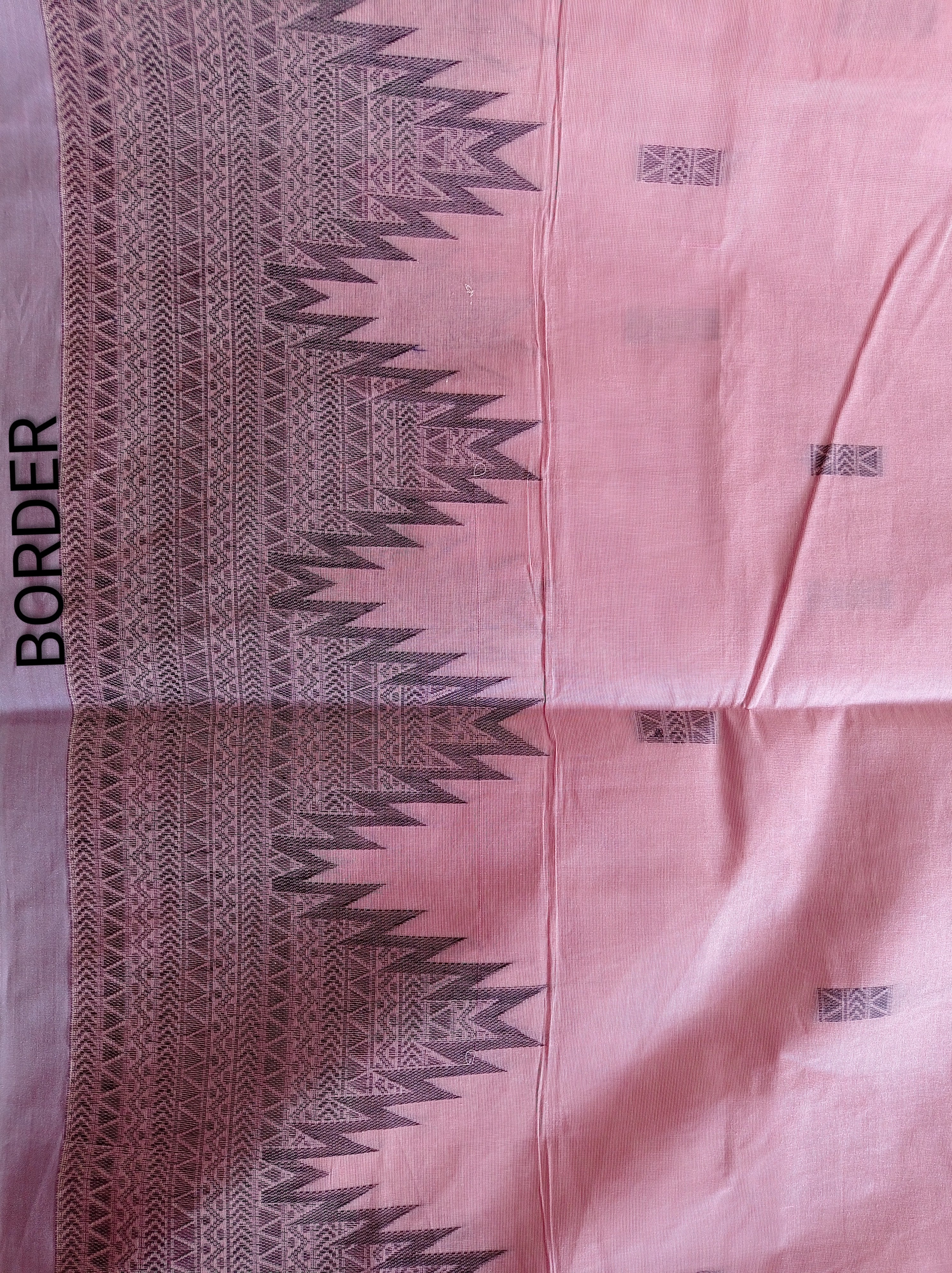 Pastel pink cotton saree with black buttas & one side temple border