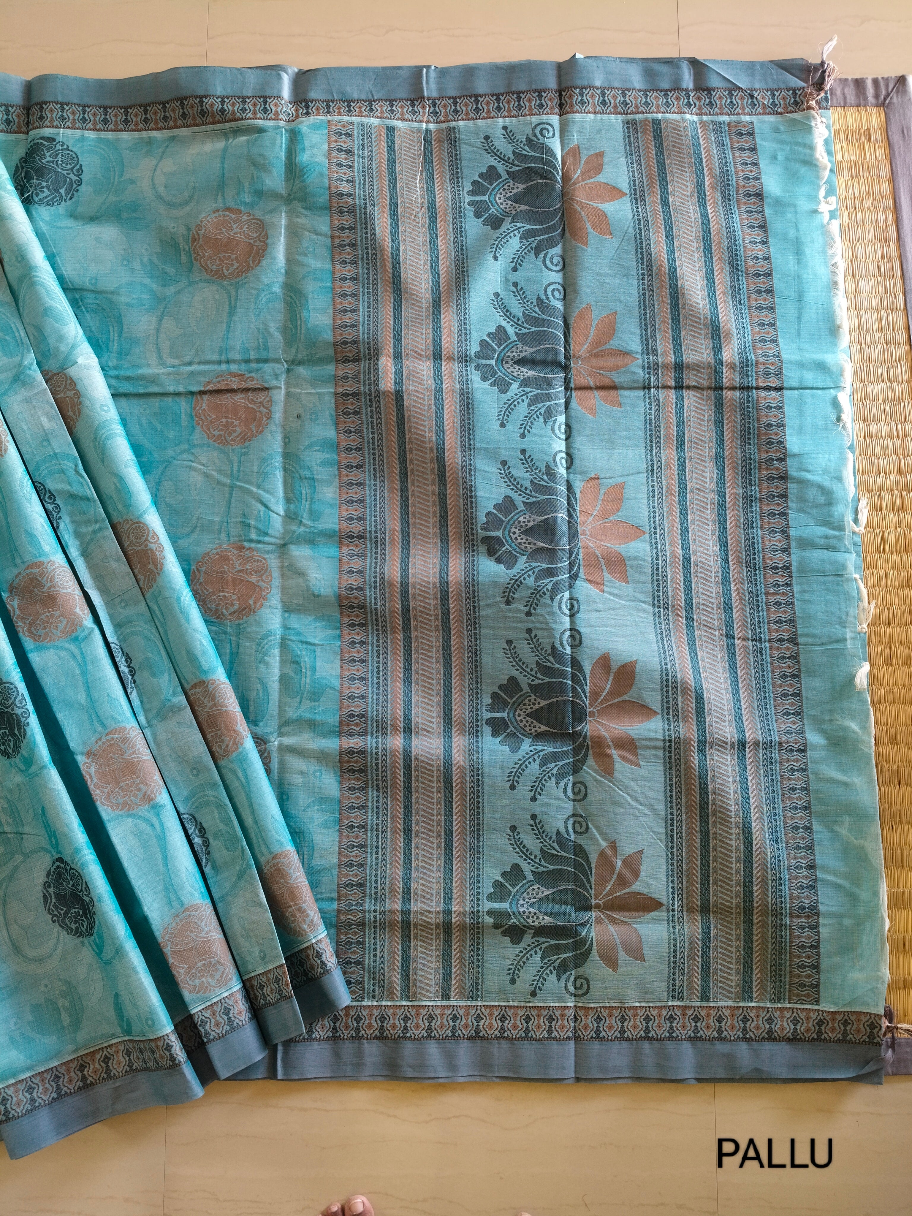 Blue embossed cotton saree with horse butta thread work