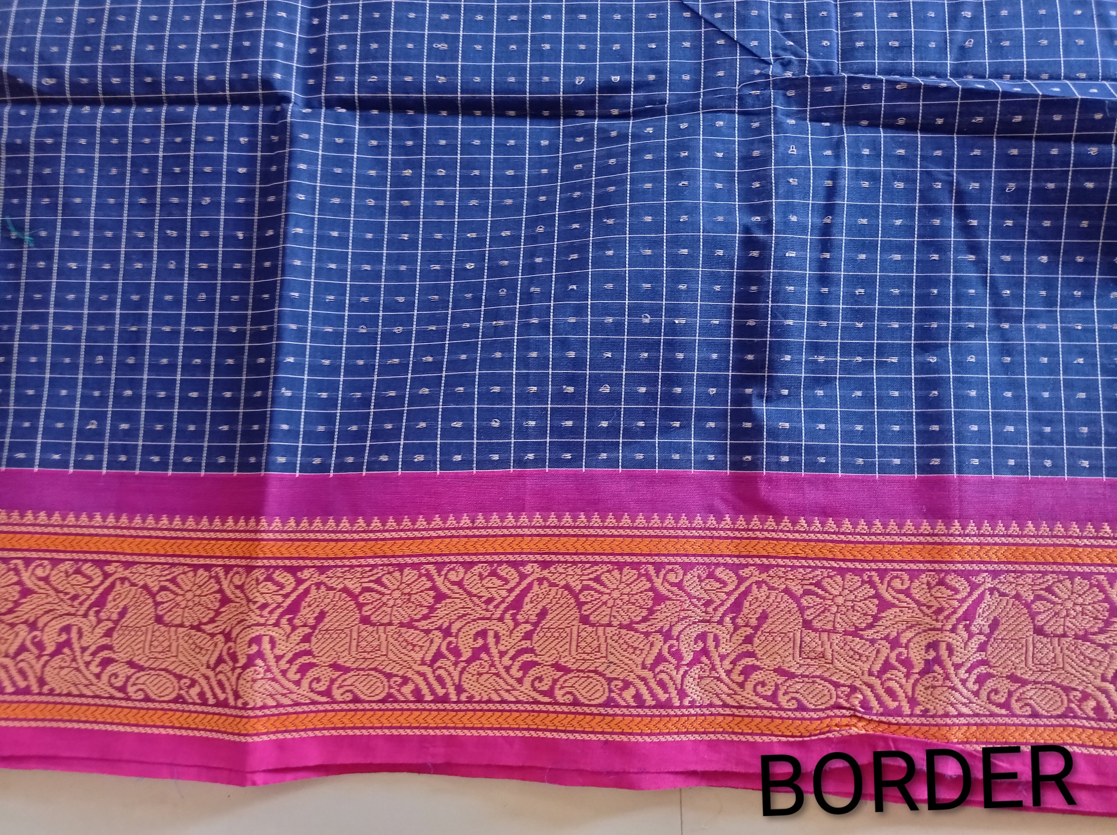 Blue Lakshadeepam saree with pink embroidered border