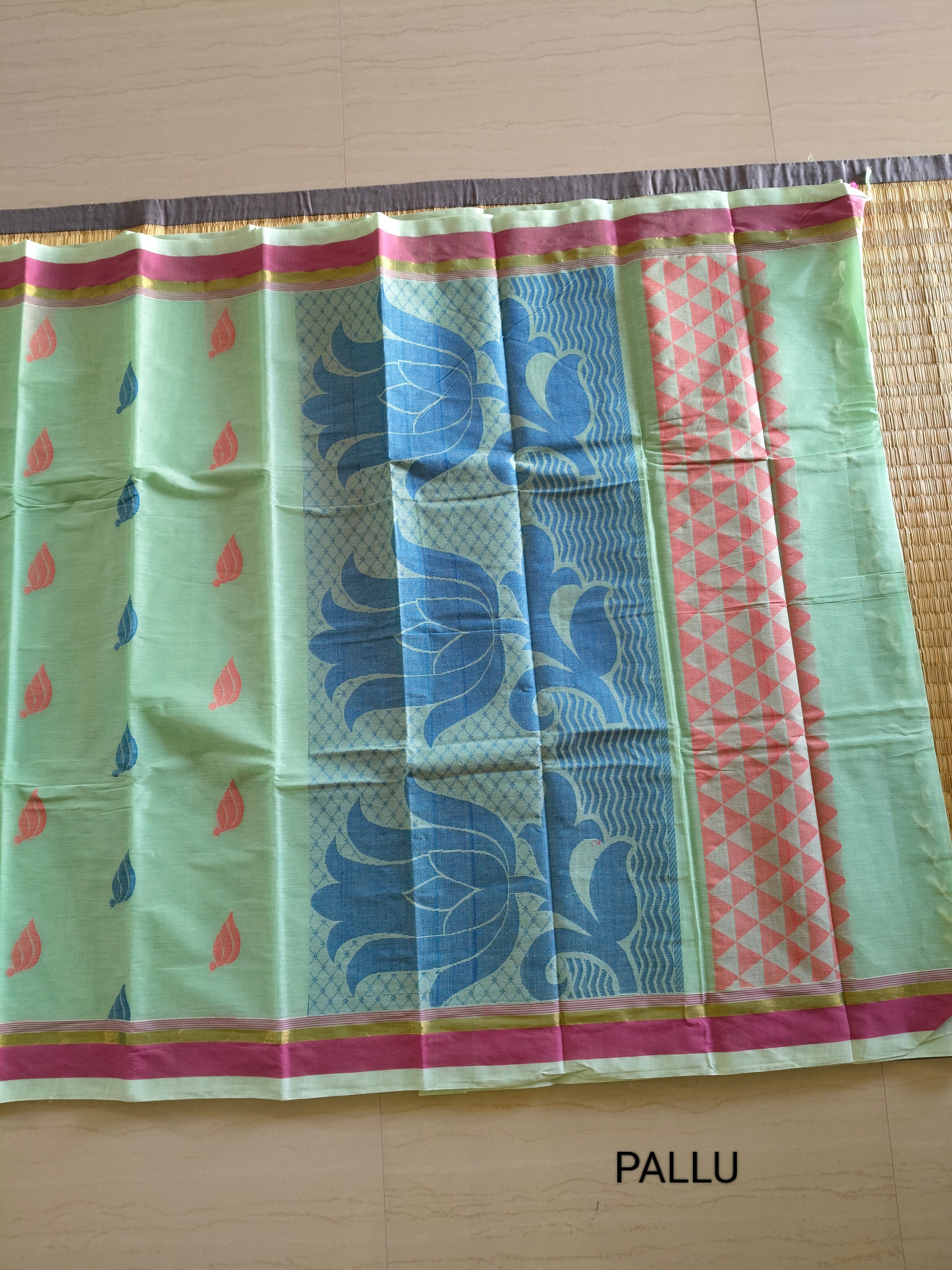 Tea green cotton saree with flower buttas