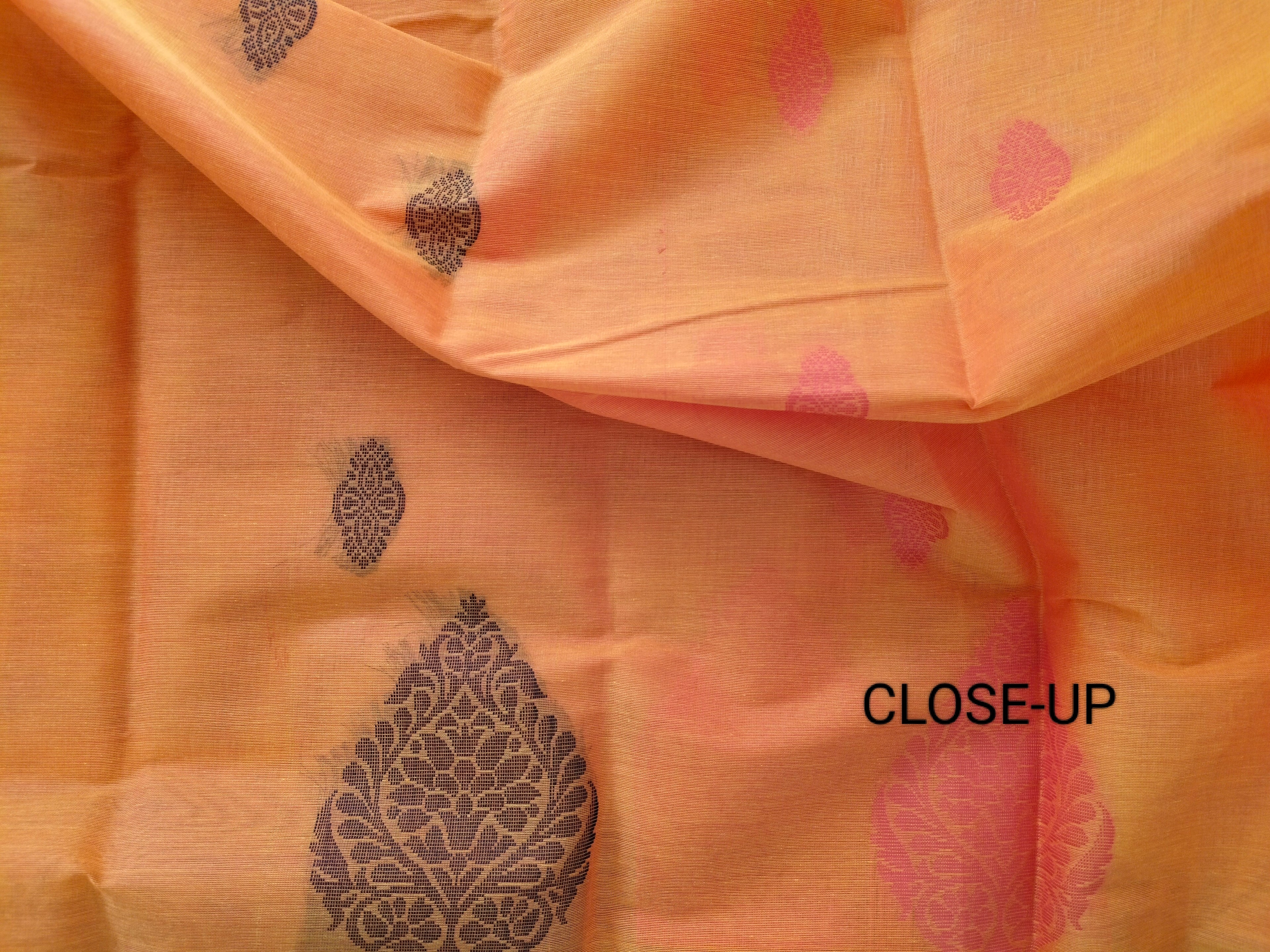 Pumpkin Orange cotton saree with black buttas