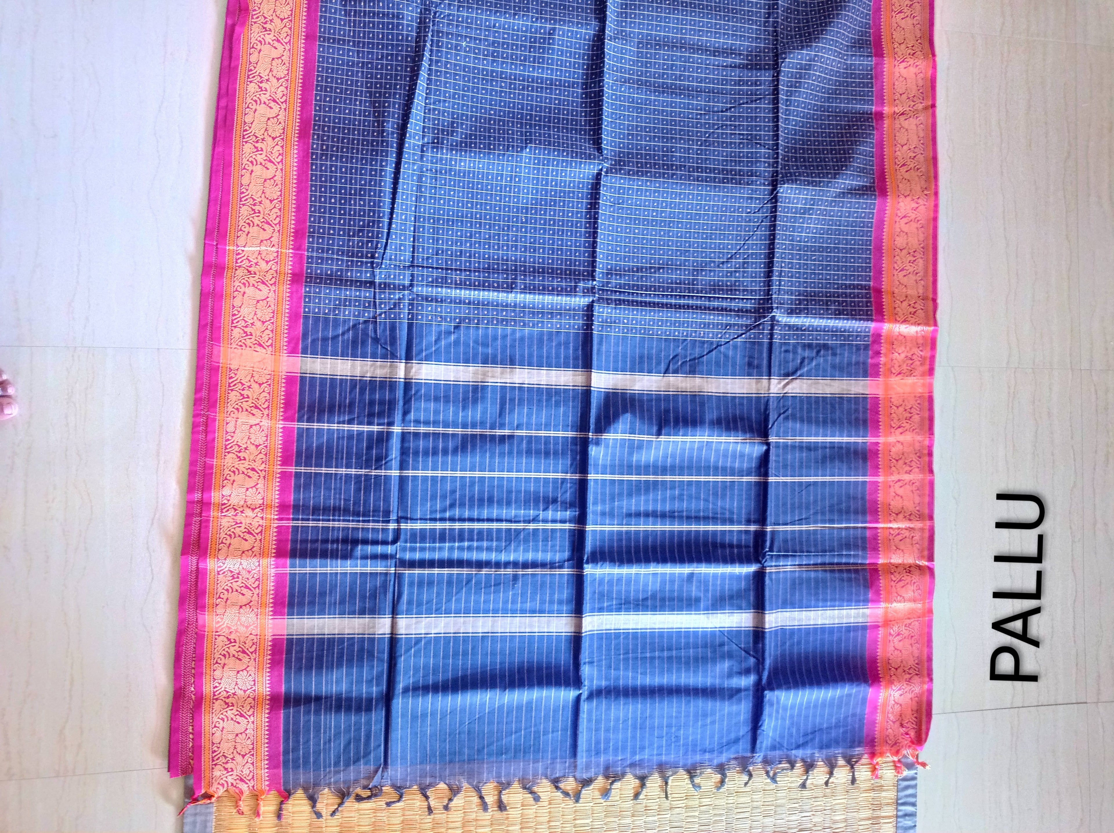 Blue Lakshadeepam saree with pink embroidered border