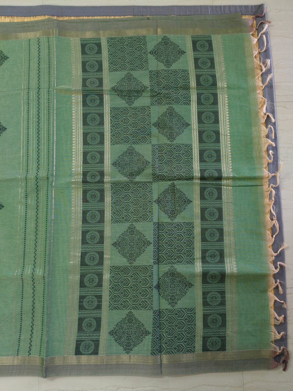Green cotton saree with golden zari vertical lines & buttas