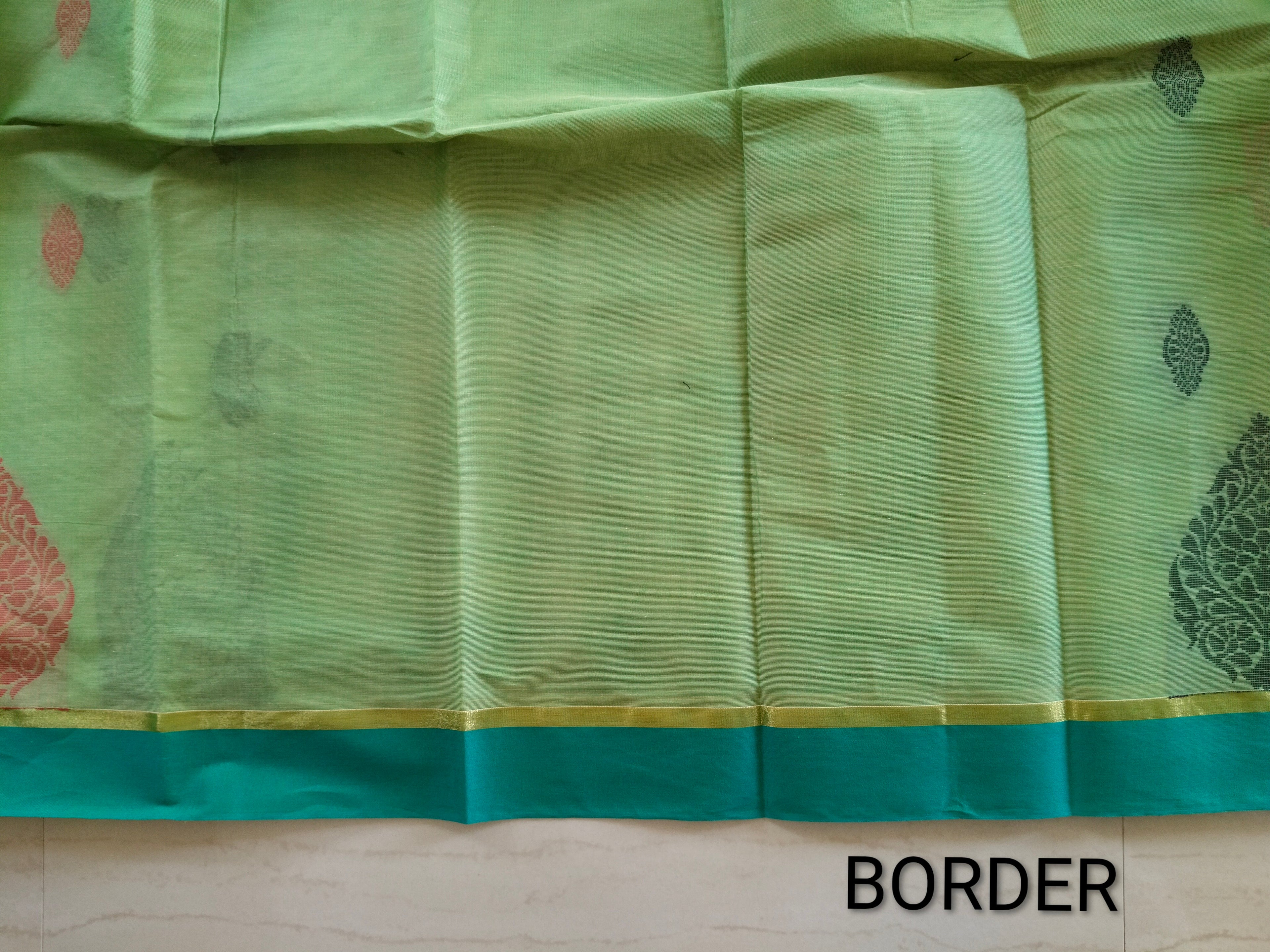 Light green dual tone cotton saree with thread buttas