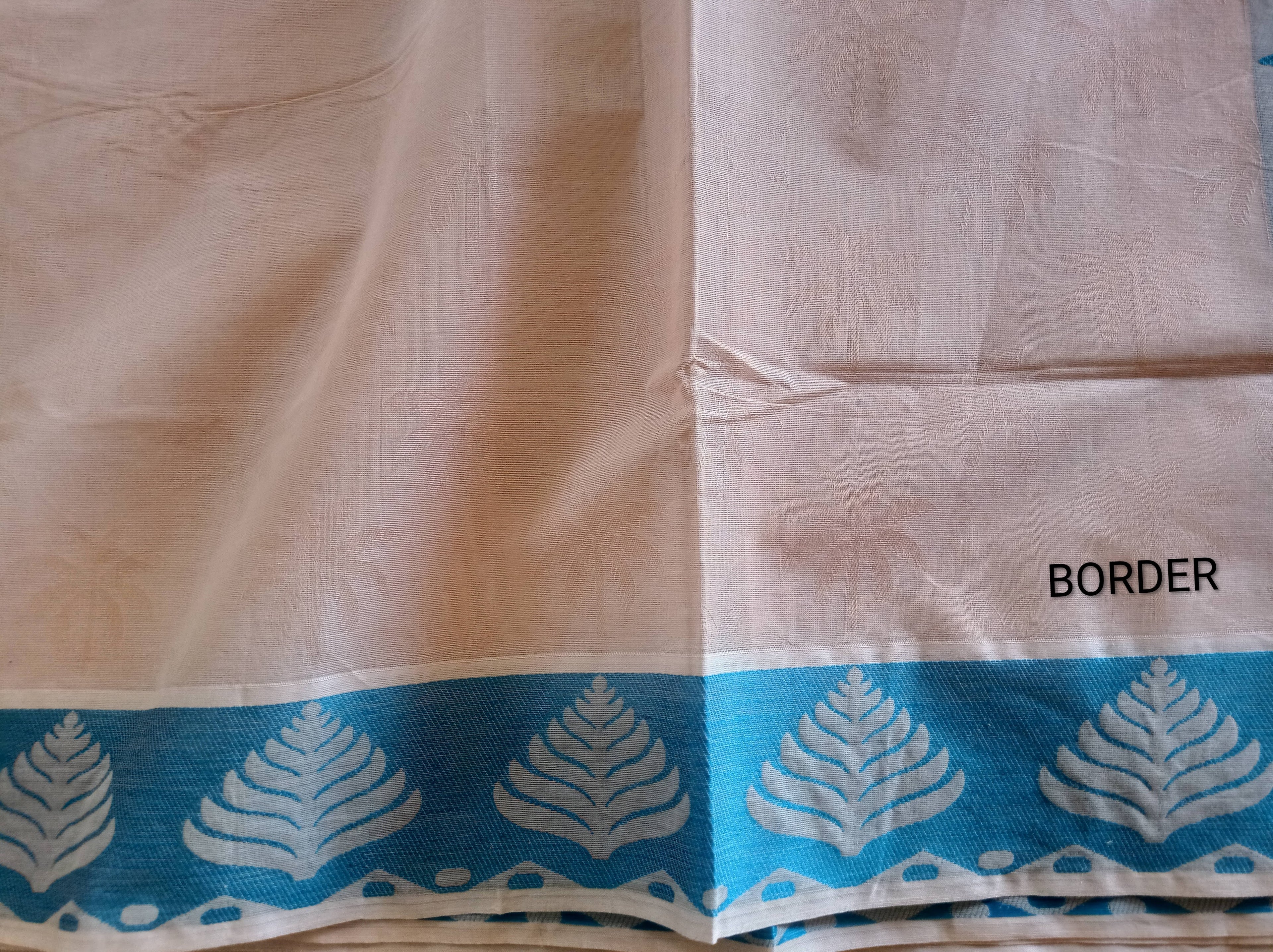 Pastel cream embossed cotton saree with blue thread work