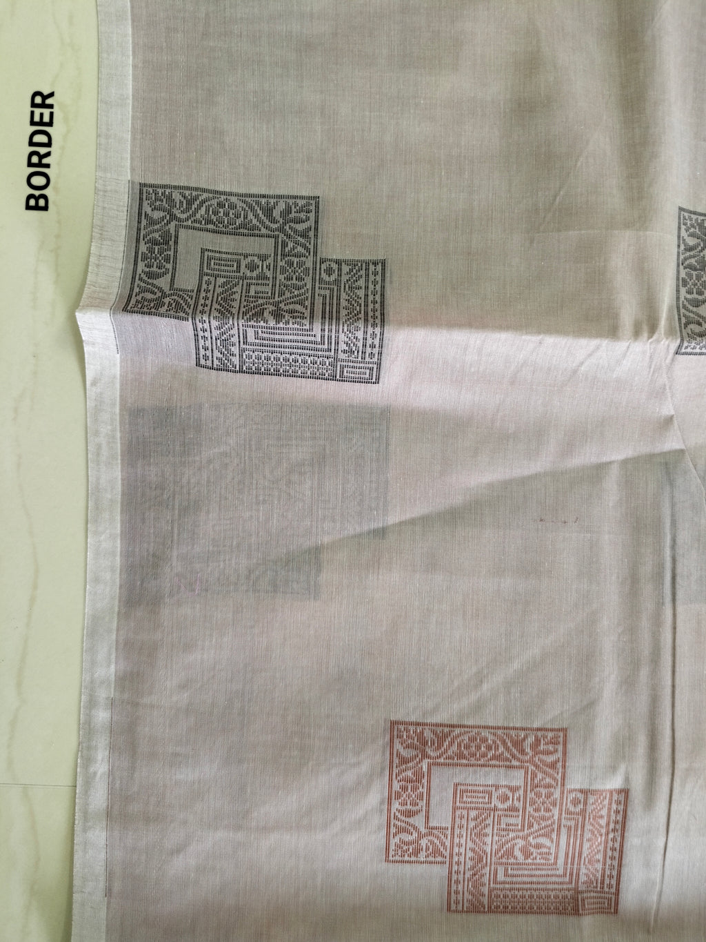 Almond pink cotton saree with square buttas