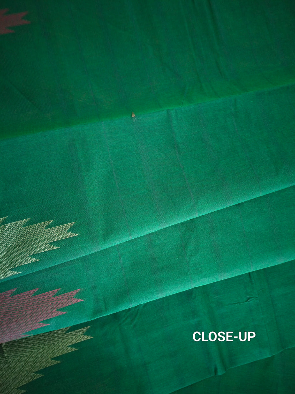 Dark green cotton saree with temple border