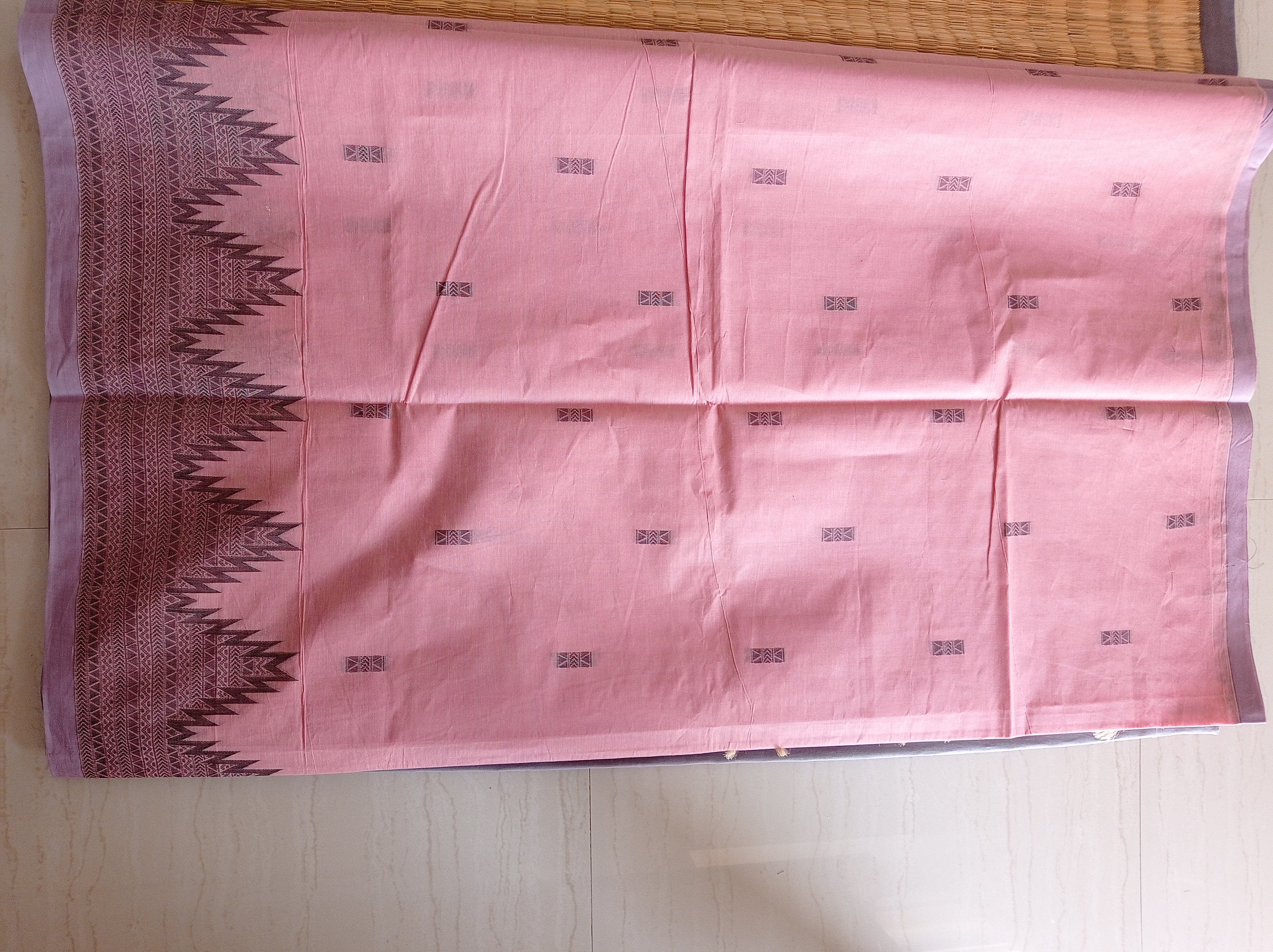 Pastel pink cotton saree with black buttas & one side temple border