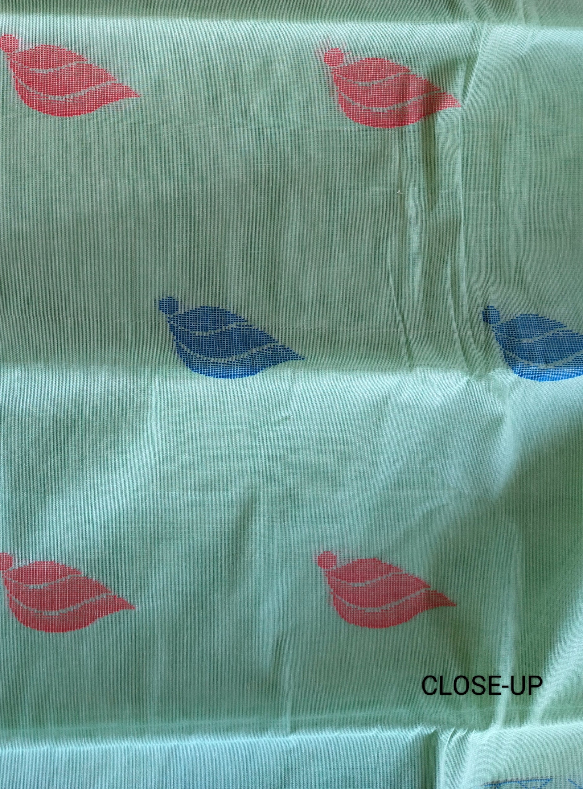 Tea green cotton saree with flower buttas