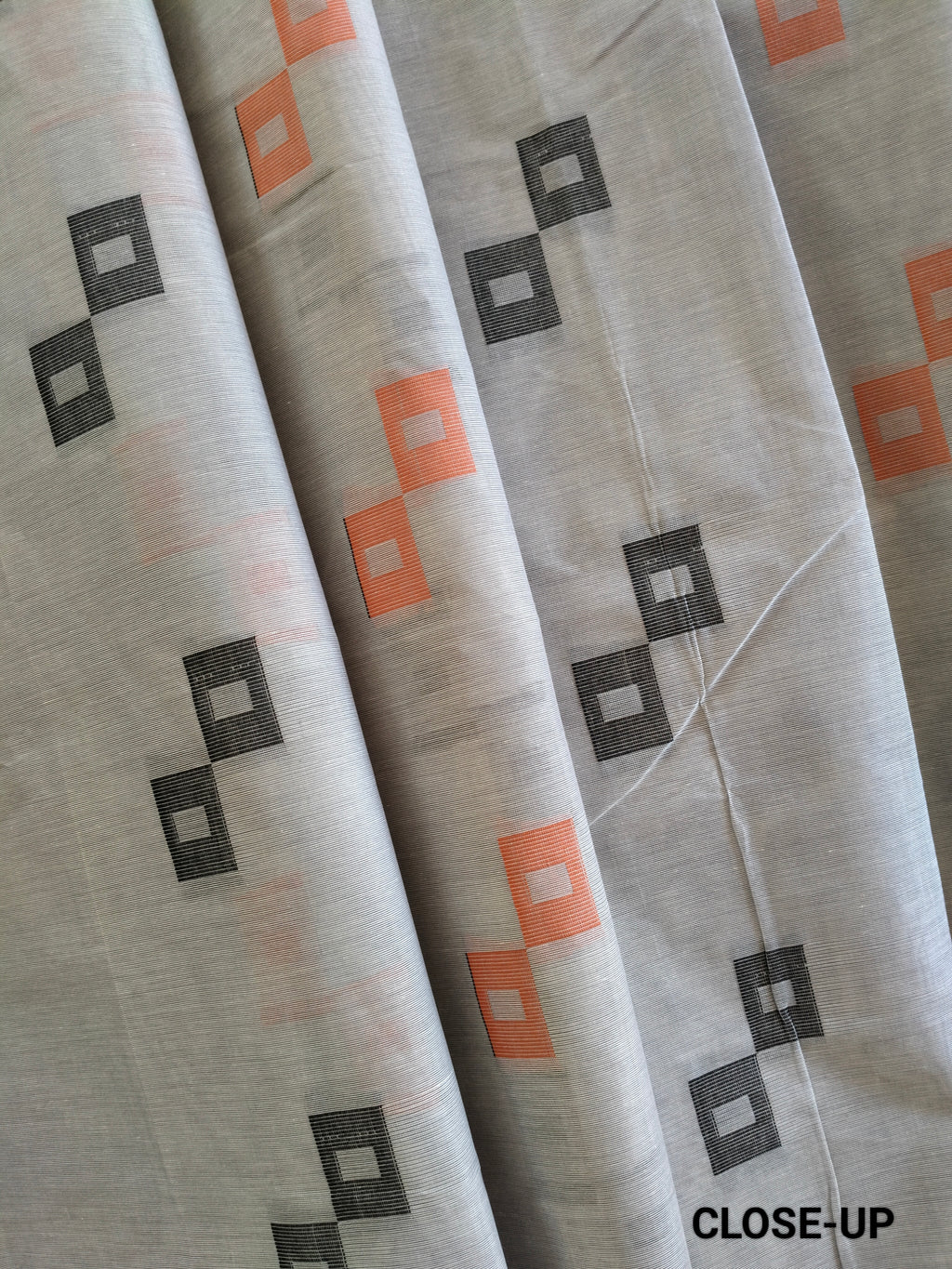 Grey cotton saree with square buttas