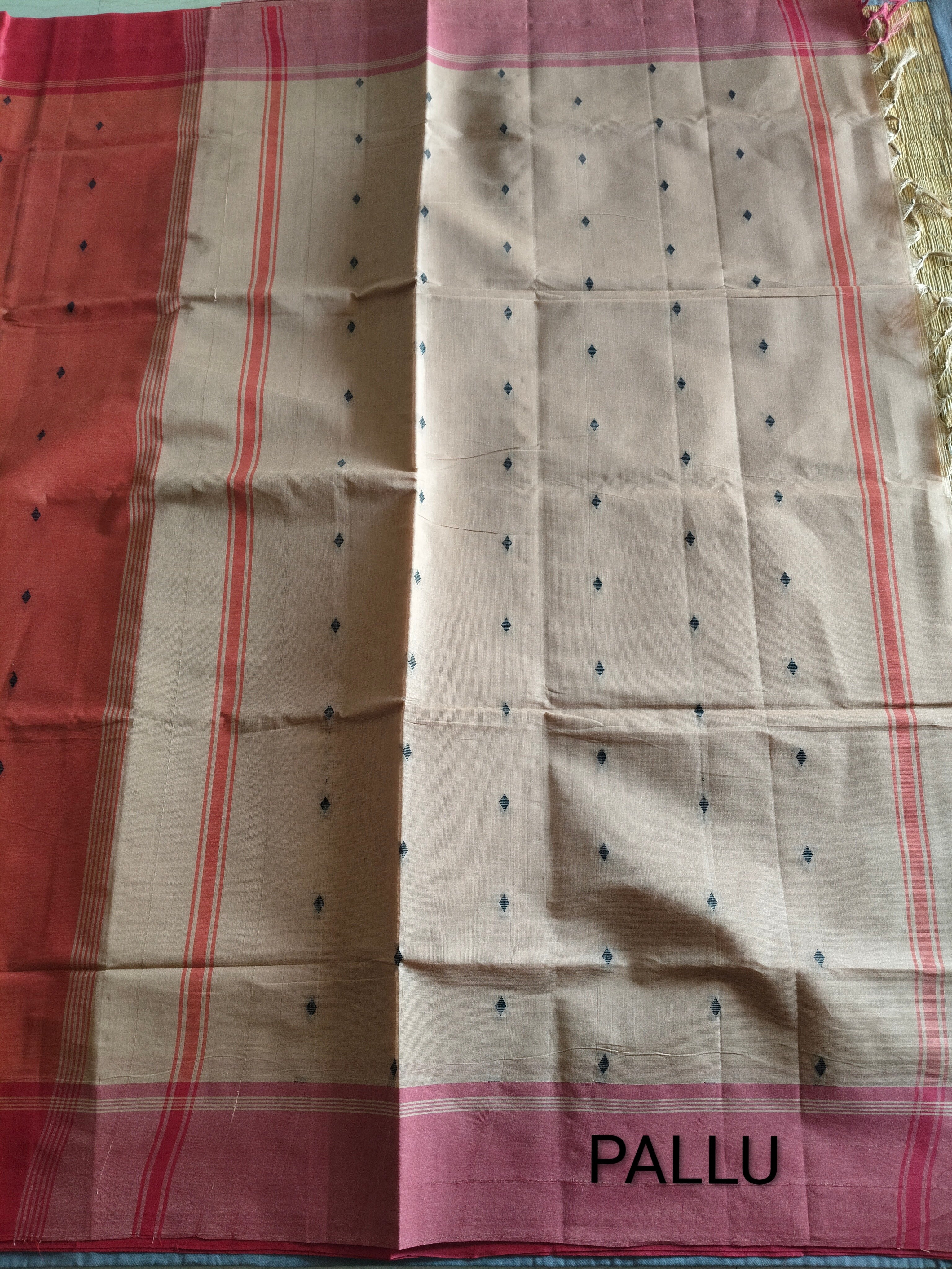 Tart orange cotton saree with beige pallu