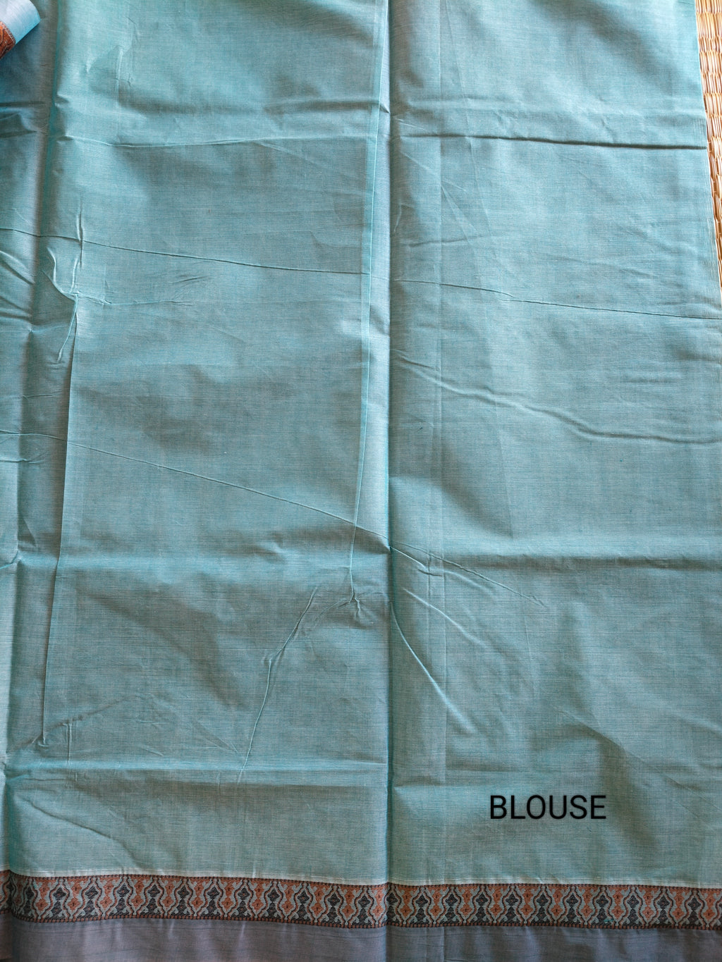 Blue embossed cotton saree with horse butta thread work