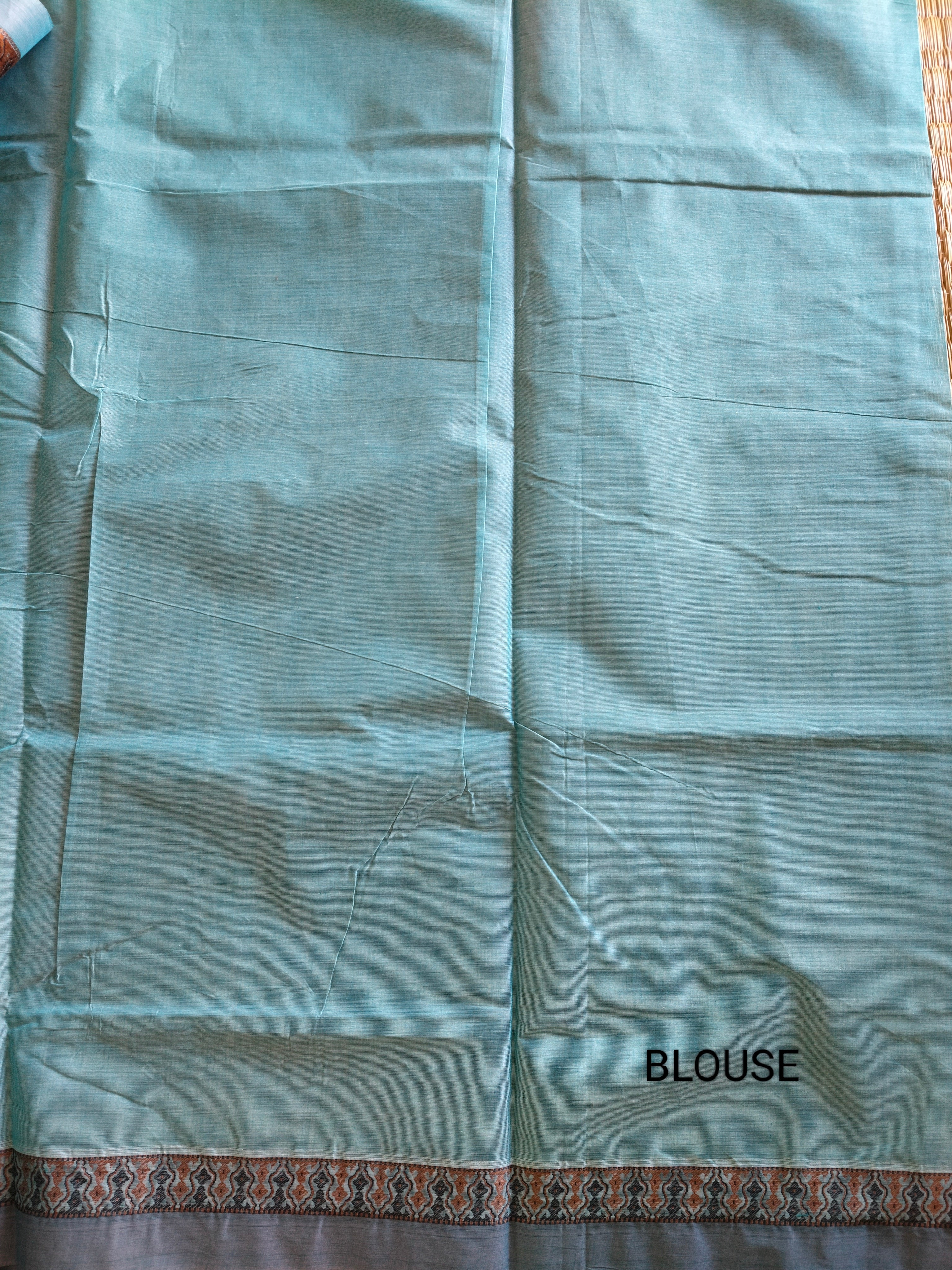 Blue embossed cotton saree with horse butta thread work