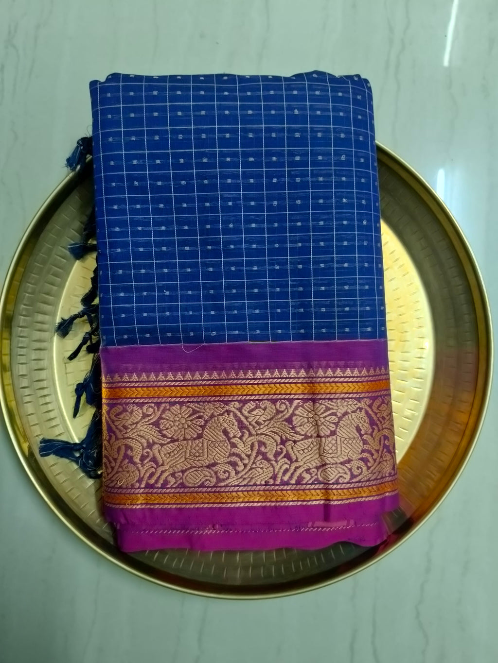 Blue Lakshadeepam saree with pink embroidered border